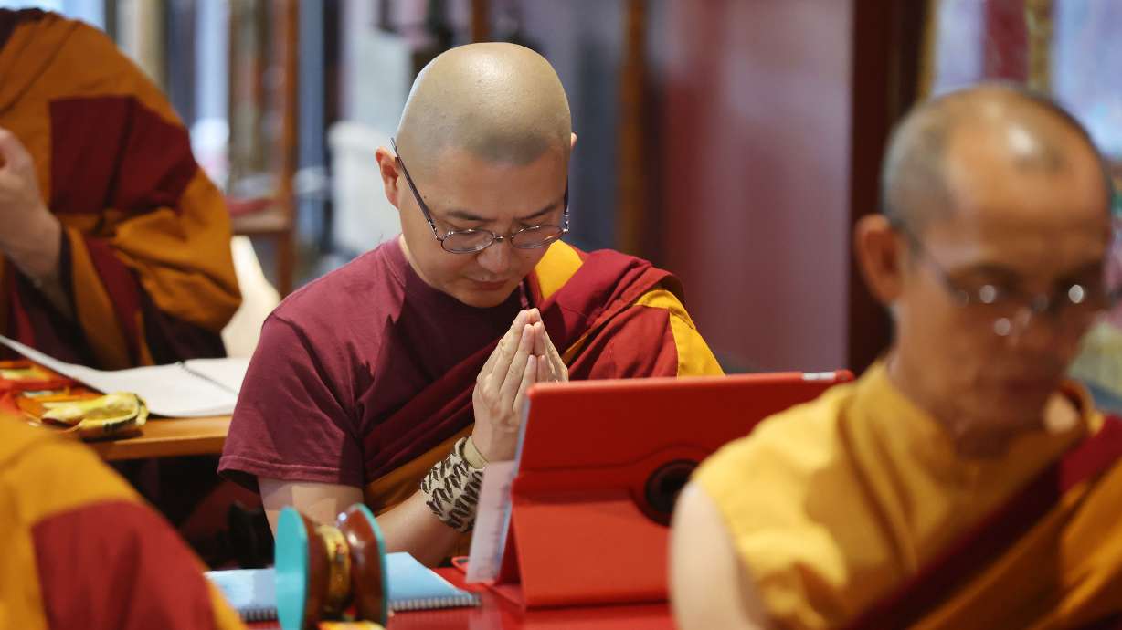 Practitioners at the Urgyen Samten Ling Tibetan Buddhist Temple participate in Prayers for Compassion in Salt Lake City on Thursday.