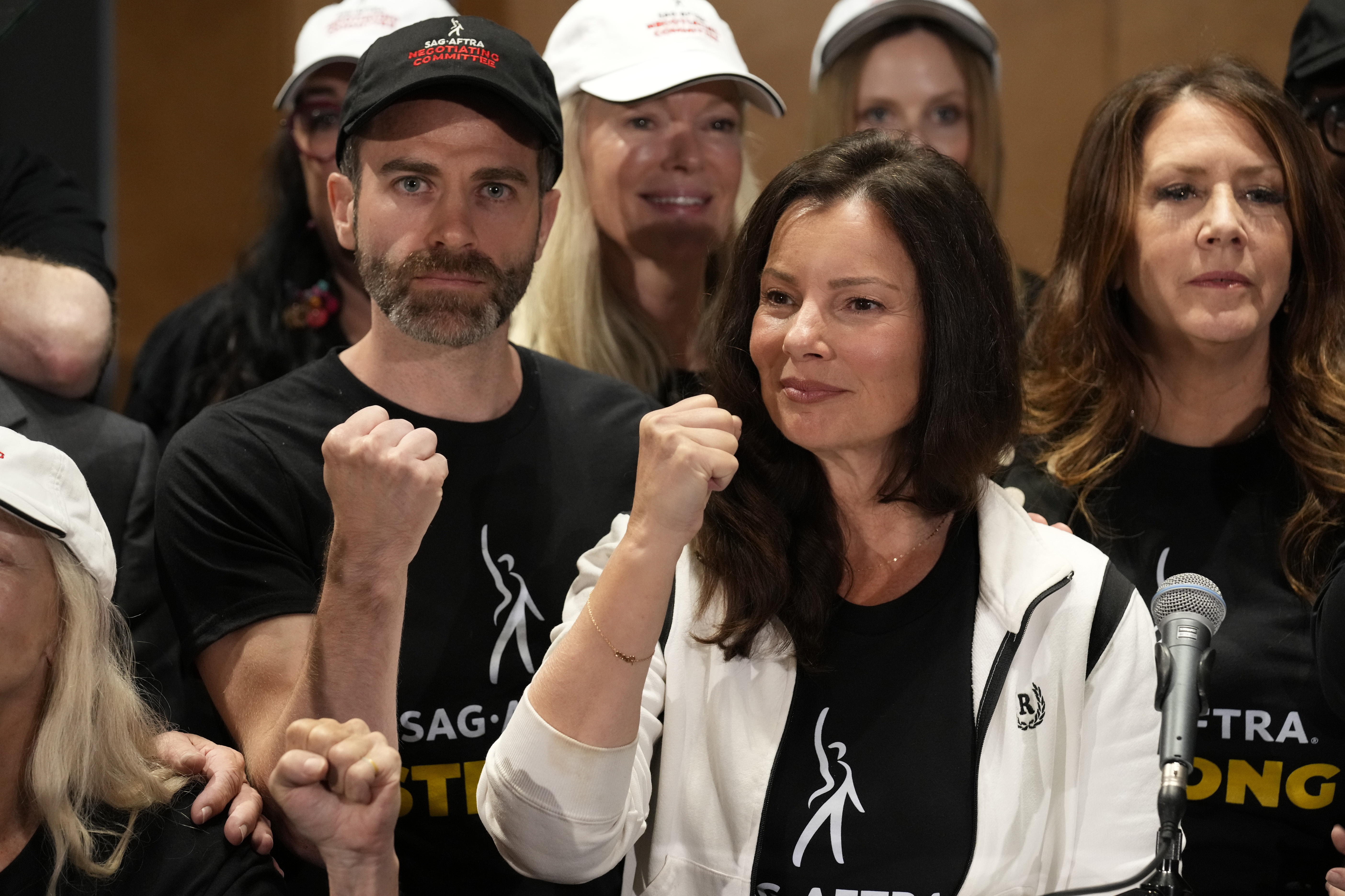 SAG-AFTRA president Fran Drescher, center, Ben Whitehair, left, and Joely Fisher attend a press conference announcing a strike by The Screen Actors Guild-American Federation of Television and Radio Artists on Thursday in Los Angeles.