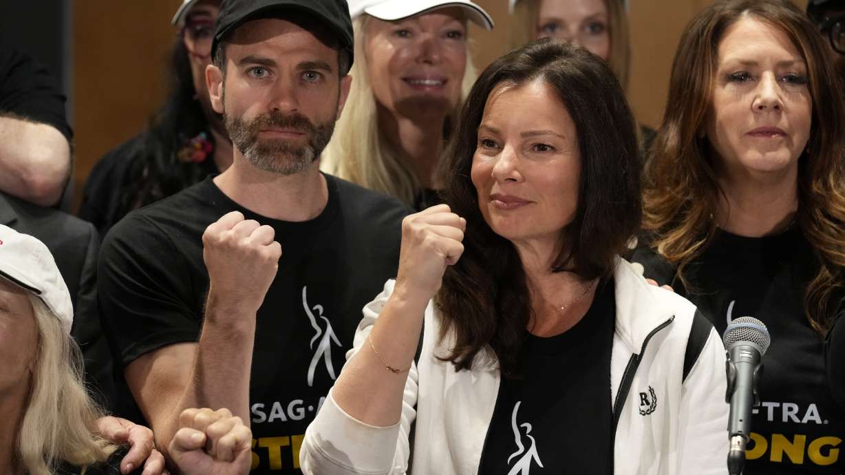 SAG-AFTRA president Fran Drescher, center, Ben Whitehair, left, and Joely Fisher attend a press conference announcing a strike by The Screen Actors Guild-American Federation of Television and Radio Artists on Thursday in Los Angeles.