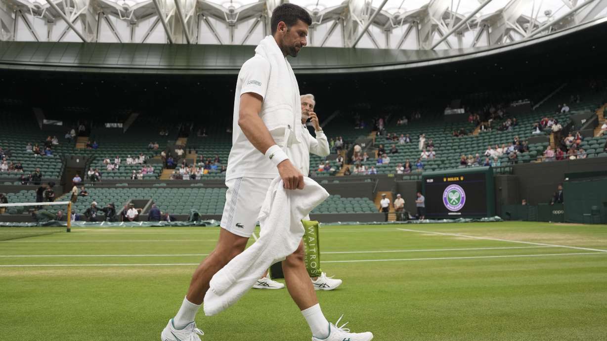 Serbia's Novak Djokovic leaves the court after practicing on Court One ahead of his men's singles semifinal match against Italy's Jannik Sinner on day twelve of the Wimbledon tennis championships in London, Friday, July 14, 2023.