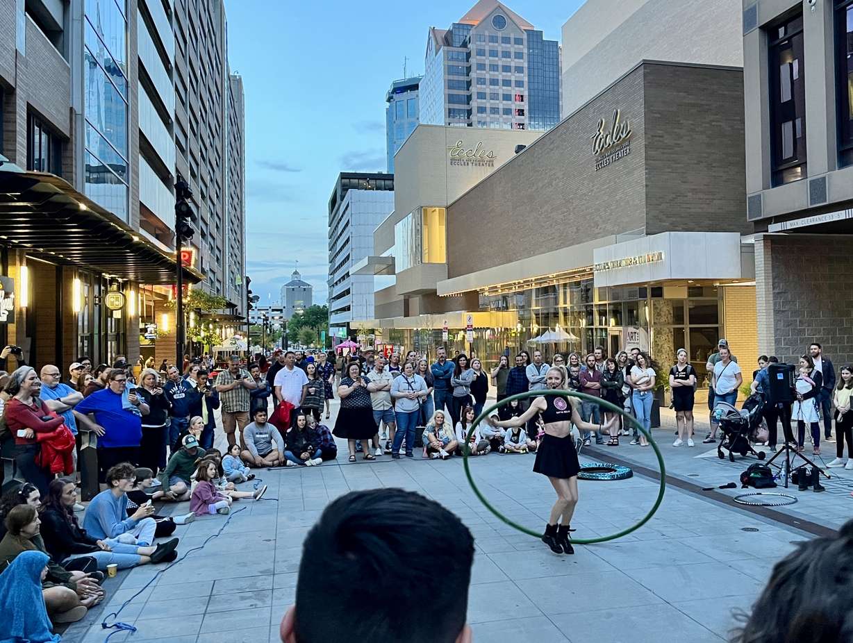 A crowd forms on Regent Street in downtown Salt Lake City to watch a street performer during the Salt Lake City Busker Fest on May 26.