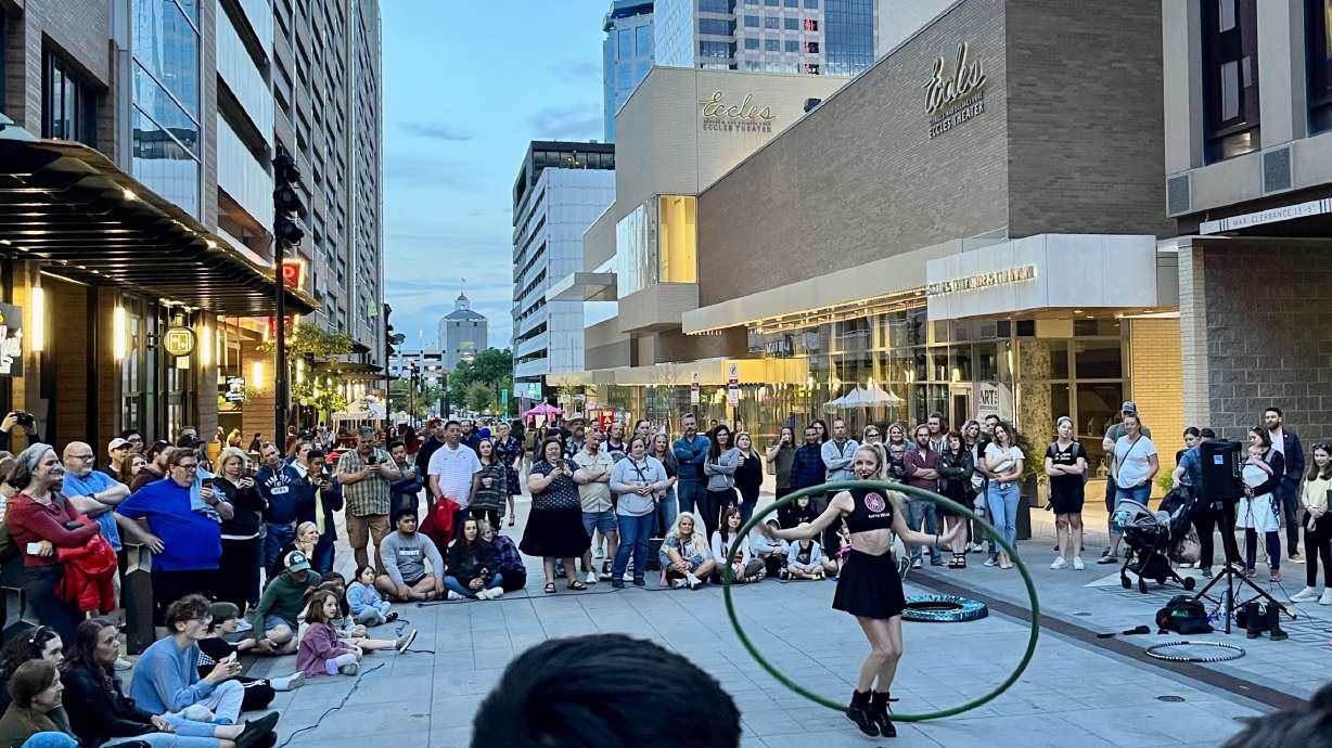 A crowd forms on Regent Street in downtown Salt Lake City to watch a street performer during the Salt Lake City Busker Fest on May 26. Researchers say activity in downtown Salt Lake City isn't as robust as they previous reported.
