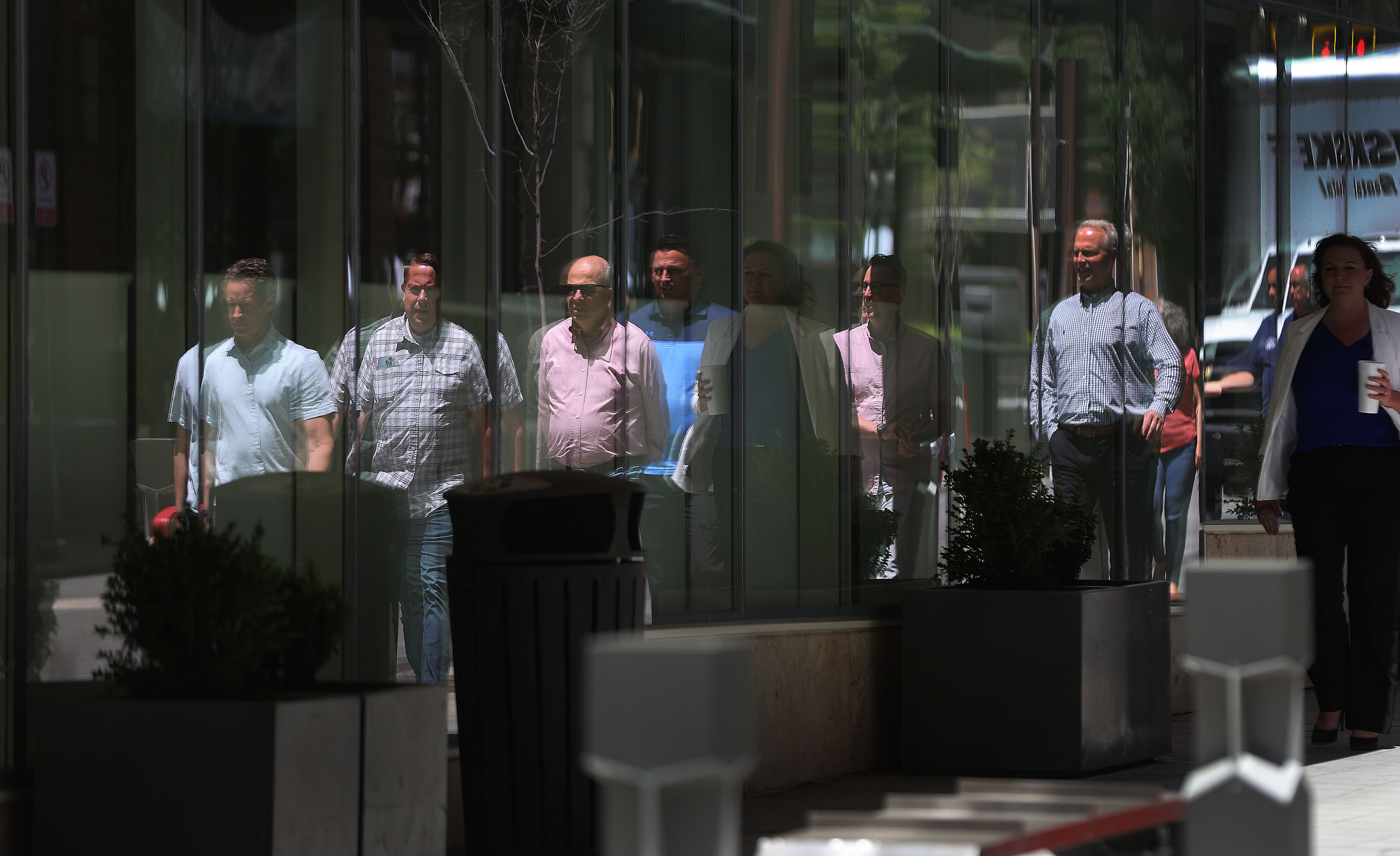 A reflection of pedestrians as they walk on Regent Street in Salt Lake City on May 31. Salt Lake City government and business leaders say the city is quickly becoming a destination for shopping, dining, bars and entertainment.