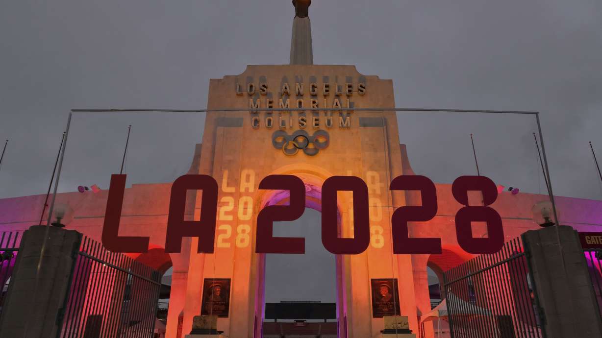 An LA2028 sign is seen in front of a blazing Olympic cauldron at the Los Angeles Memorial Coliseum on Wednesday, Sept. 13, 2017. The cauldron was lit early Wednesday morning at the stadium that was the site of the 1932 and 1984 Olympics.