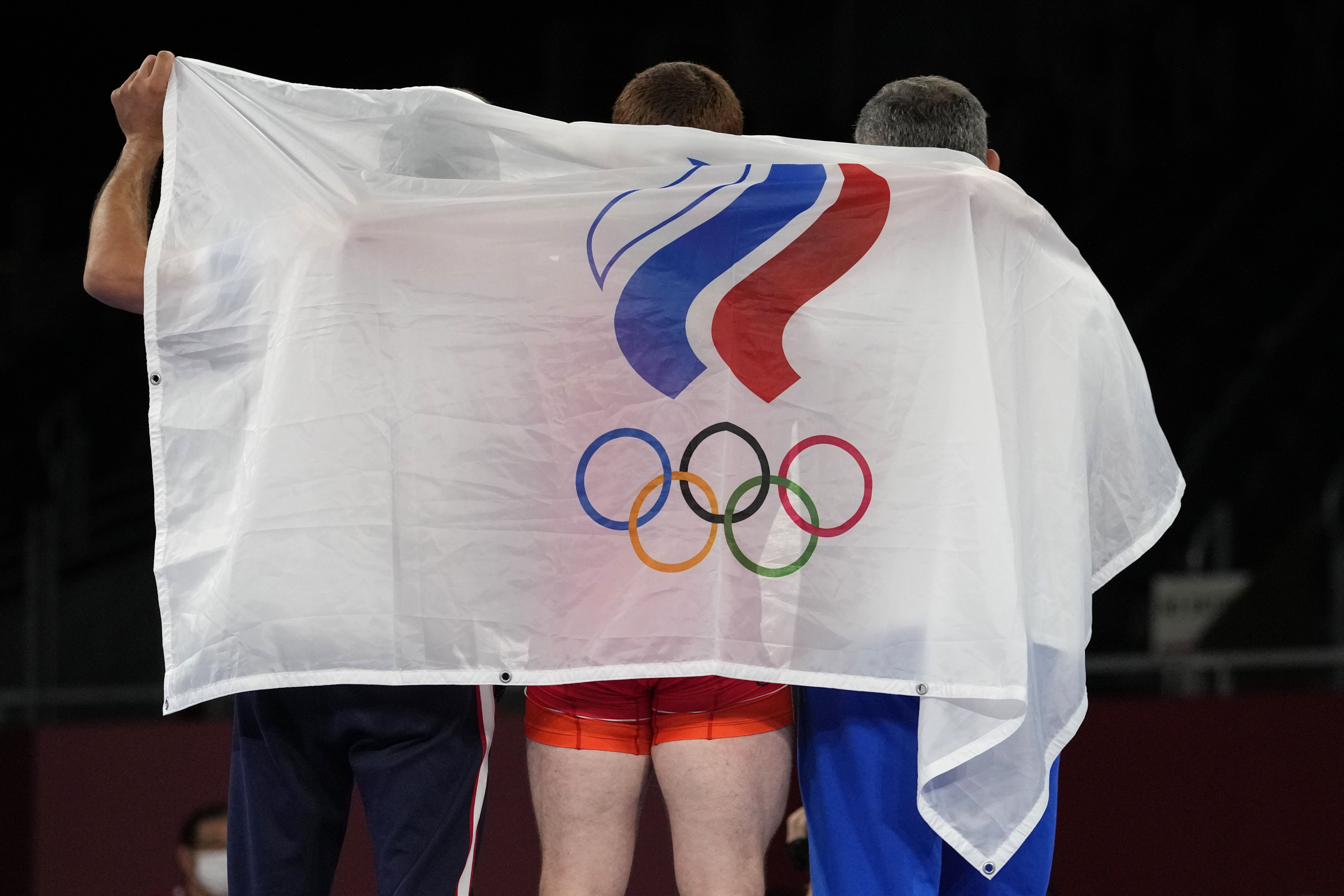 The Olympic flag is held at the 2020 Summer Olympics on Aug. 3, 2021, in Chiba, Japan. Russia and Belarus won't be invited to the 2024 Summer Games in Paris.