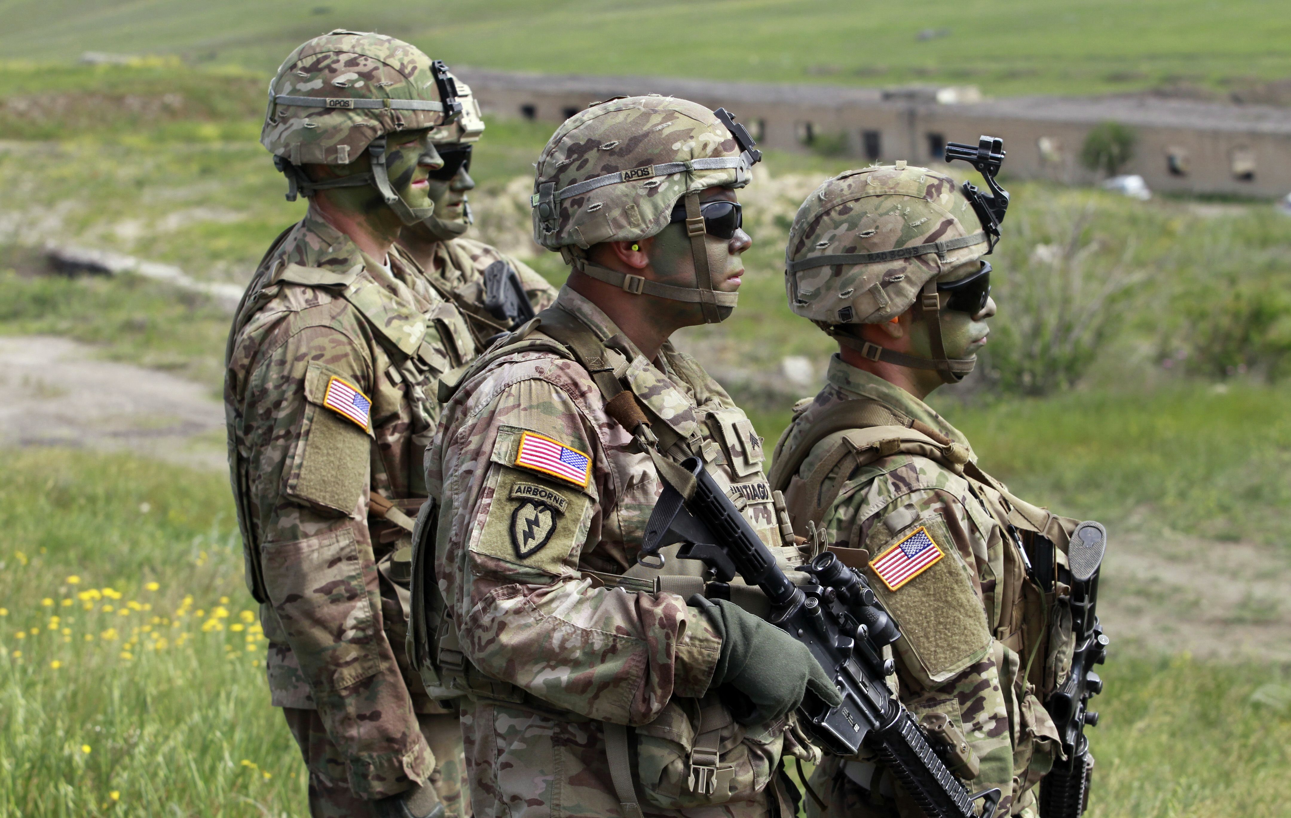 U.S. servicemen march to firing positions during joint military exercises at the Vaziani military base outside Tbilisi, Georgia, in 2016. President Joe Biden authorized the deployment of 3,000 reserve forces to Europe on Thursday.