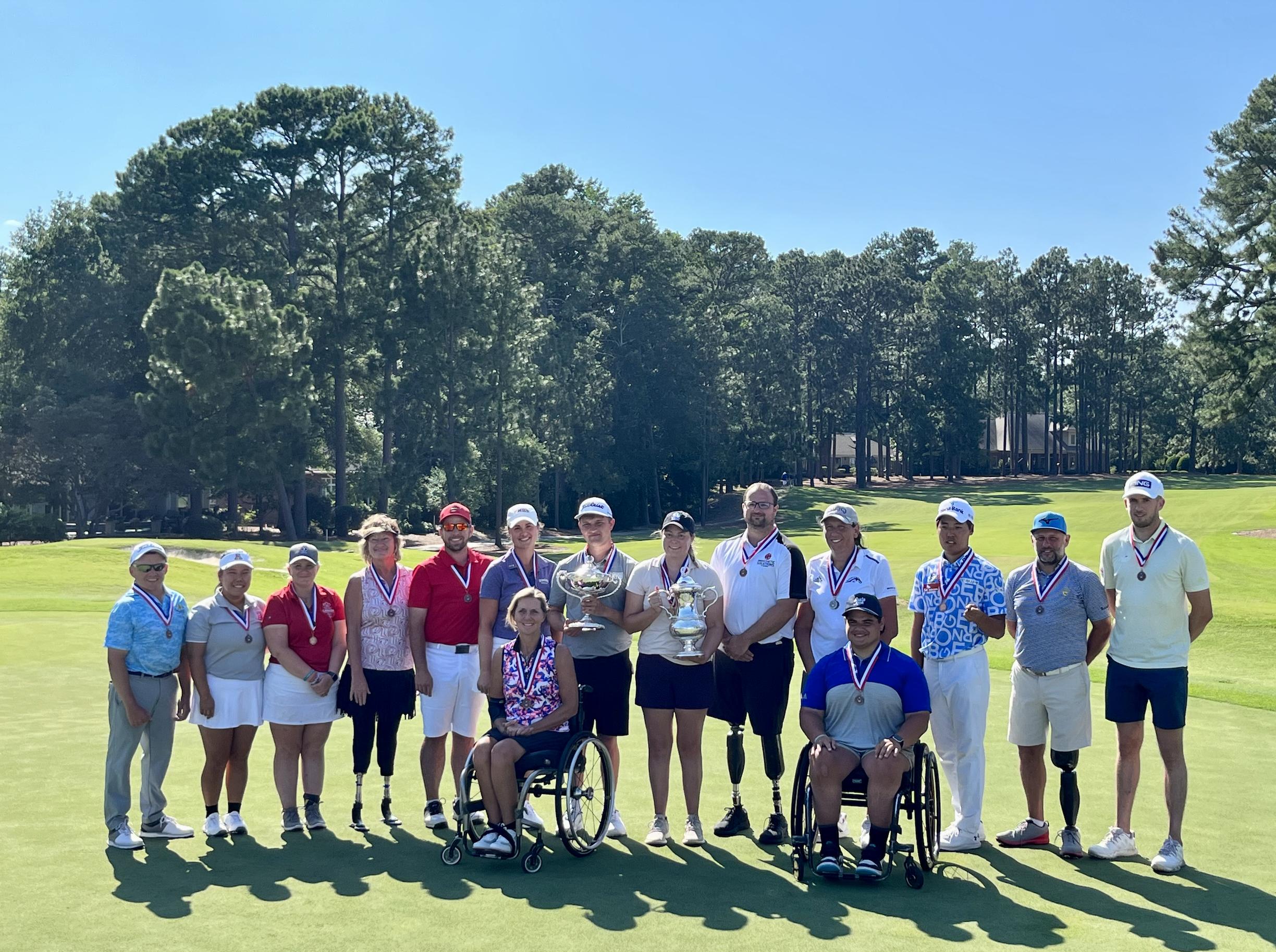 Max Togisala, front right, joins other finalists at the U.S. Adaptive Open in North Carolina. Seventeen months after being paralyzed in a skiing accident, Togisala, of Ogden, won the seated category of the tournament on July 12.
