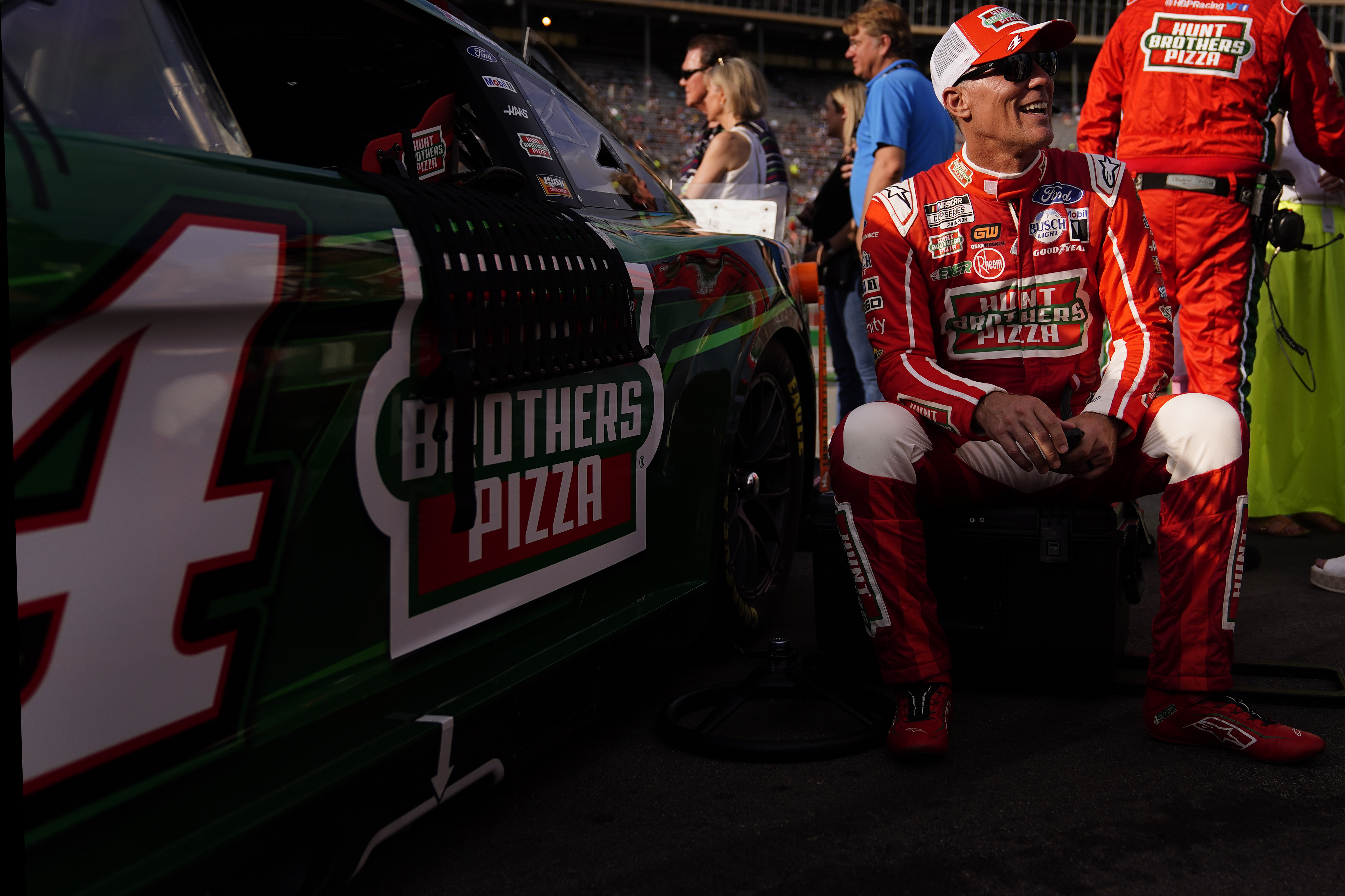 Kevin Harvick (4) sits beside his car before a NASCAR Cup Series auto race at Atlanta Motor Speedway on Sunday, July 9, 2023, in Hampton, Ga. 