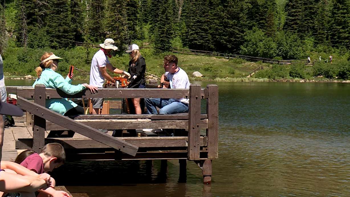 A family is seen having a picnic on Silver Lake, Sunday.