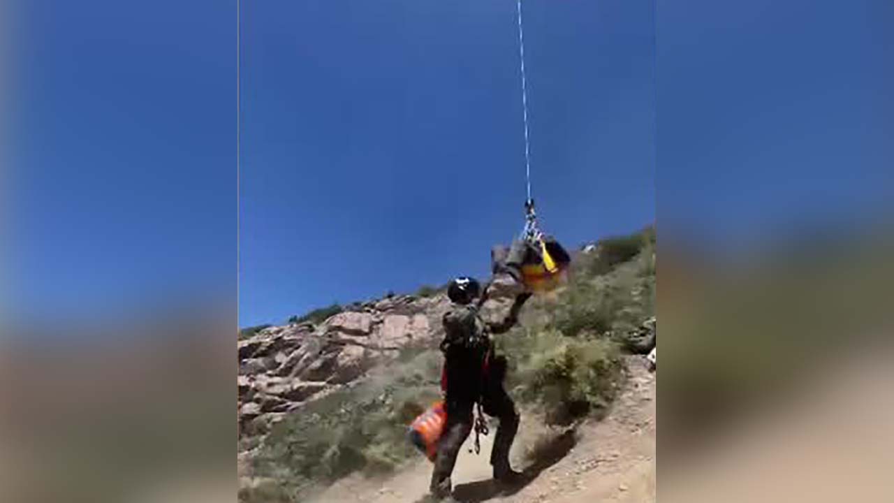 Salt Lake County Sheriff's Office Search and Rescue teams airlift a hiker in Salt Lake County Saturday.