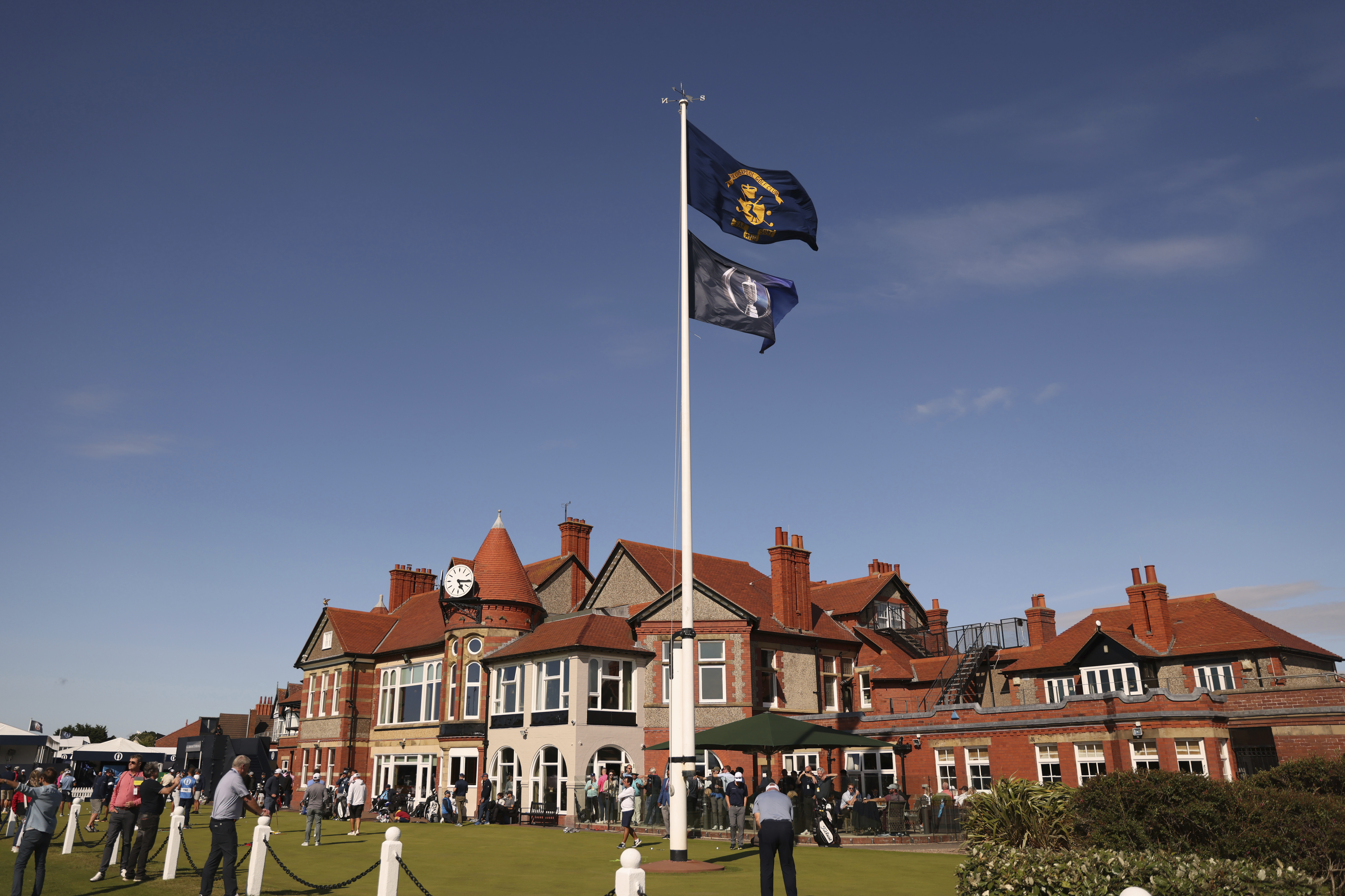 The club house of the Royal Liverpool Golf Club with golfers using the practice green ahead of the British Open Golf Championships at the Royal Liverpool Golf Club in Hoylake, England, Monday, July 17, 2023. The Open starts Thursday, July 20. 