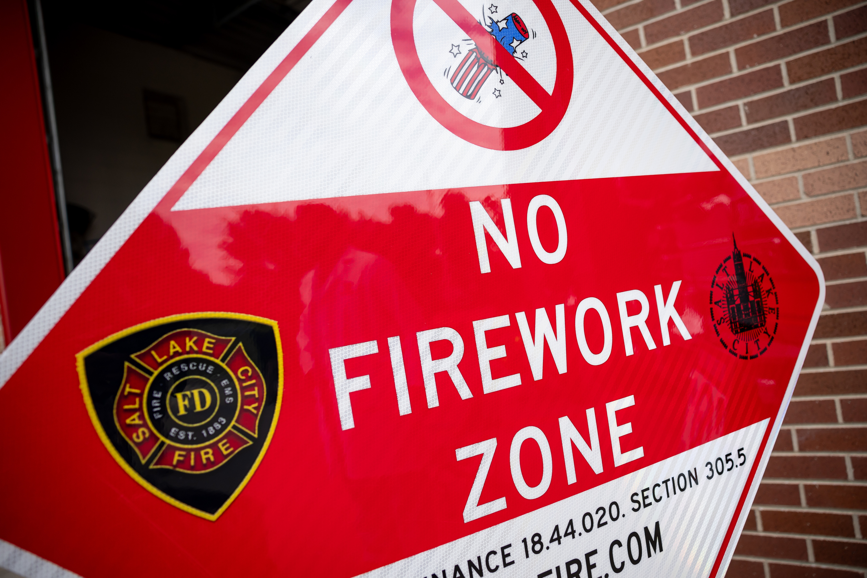 An example of a firework prohibition area sign is displayed during a press conference about heat and fire safety at Fire Station 10 in Salt Lake City on Monday.