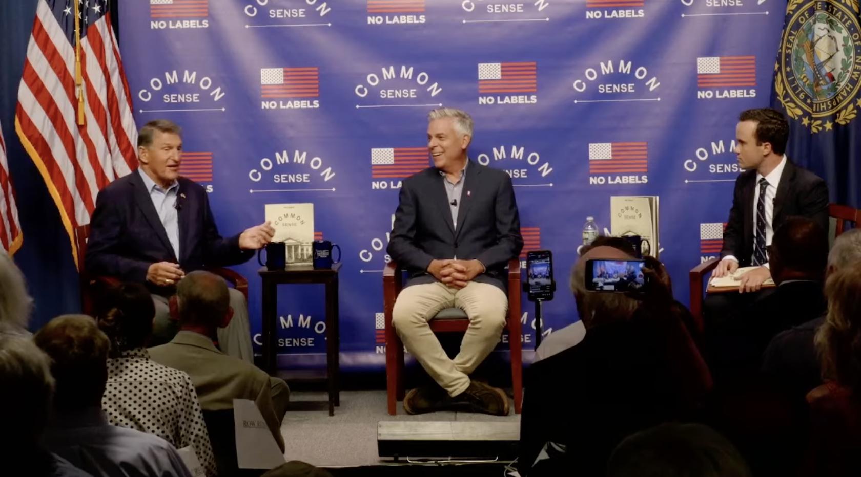 Former Utah Gov. Jon Huntsman Jr., center, sits next to Sen. Joe Manchin, D-W.Va., at a No Labels town hall event in Manchester, New Hampshire, Monday.