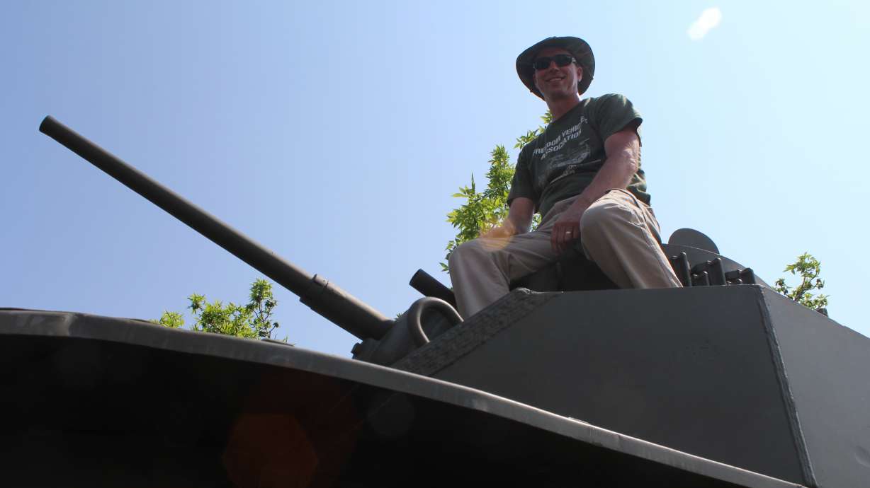 Vernon Stout sits atop his 1943 M5A1 Stuart tank at the UVU Auto Expo, May 20.