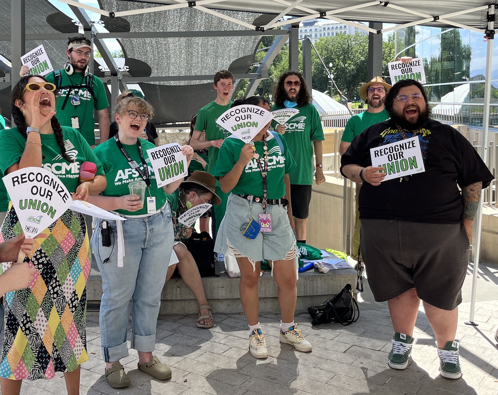 Librarians and library employees rally outside of the Salt Lake City Library before a board of directors meeting Monday. The group is asking the board to recognize its effort to unionize. 