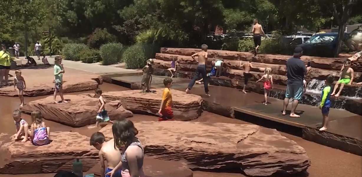 Residents of St. George turned to a water park in the city center to stay cool in southern Utah's high heat Monday.