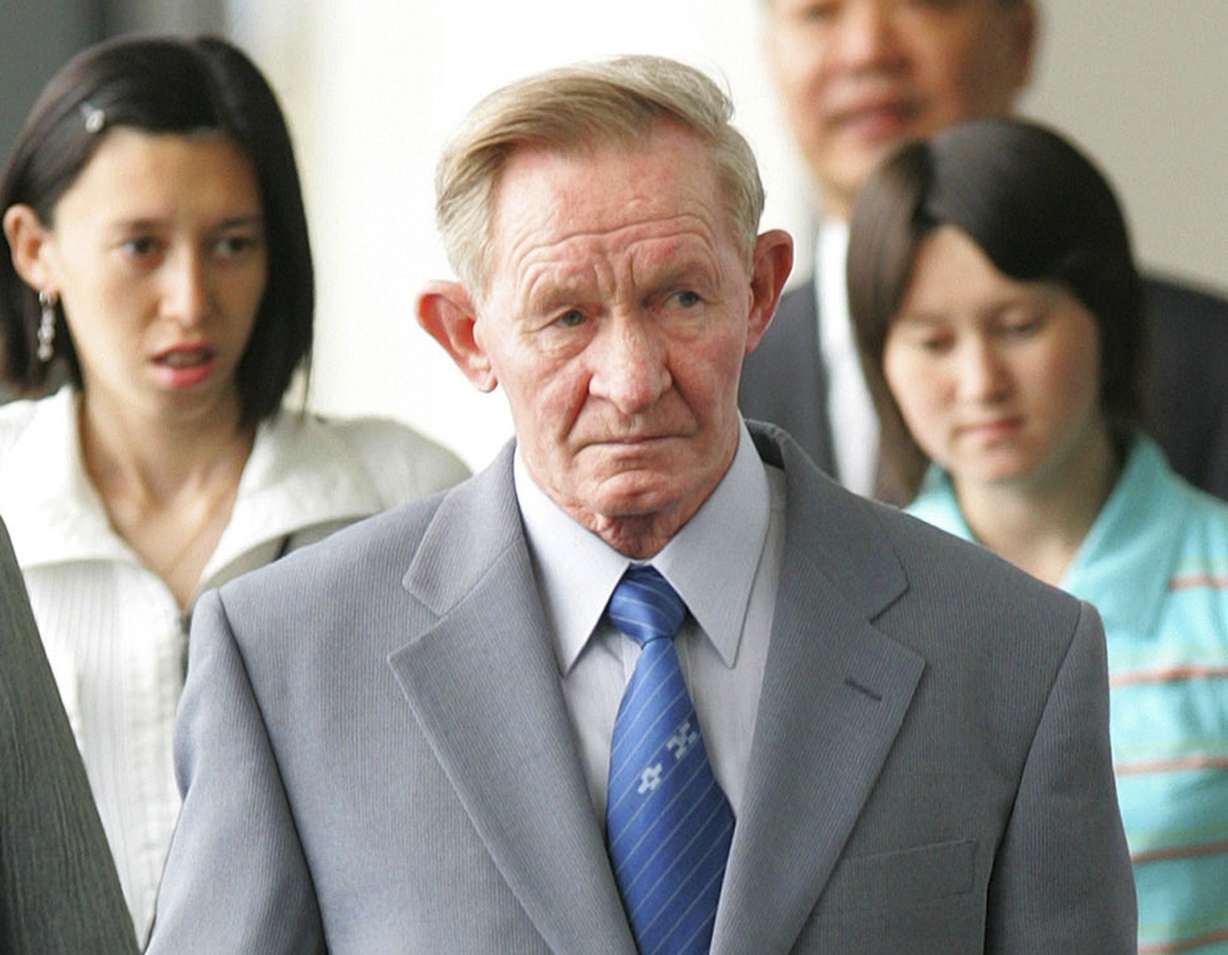 Former U.S. Army deserter to North Korea, Charles Jenkins, together with his daughters Mika, rear left, and Brinda at Narita International Airport, Japan on June 14, 2005.
