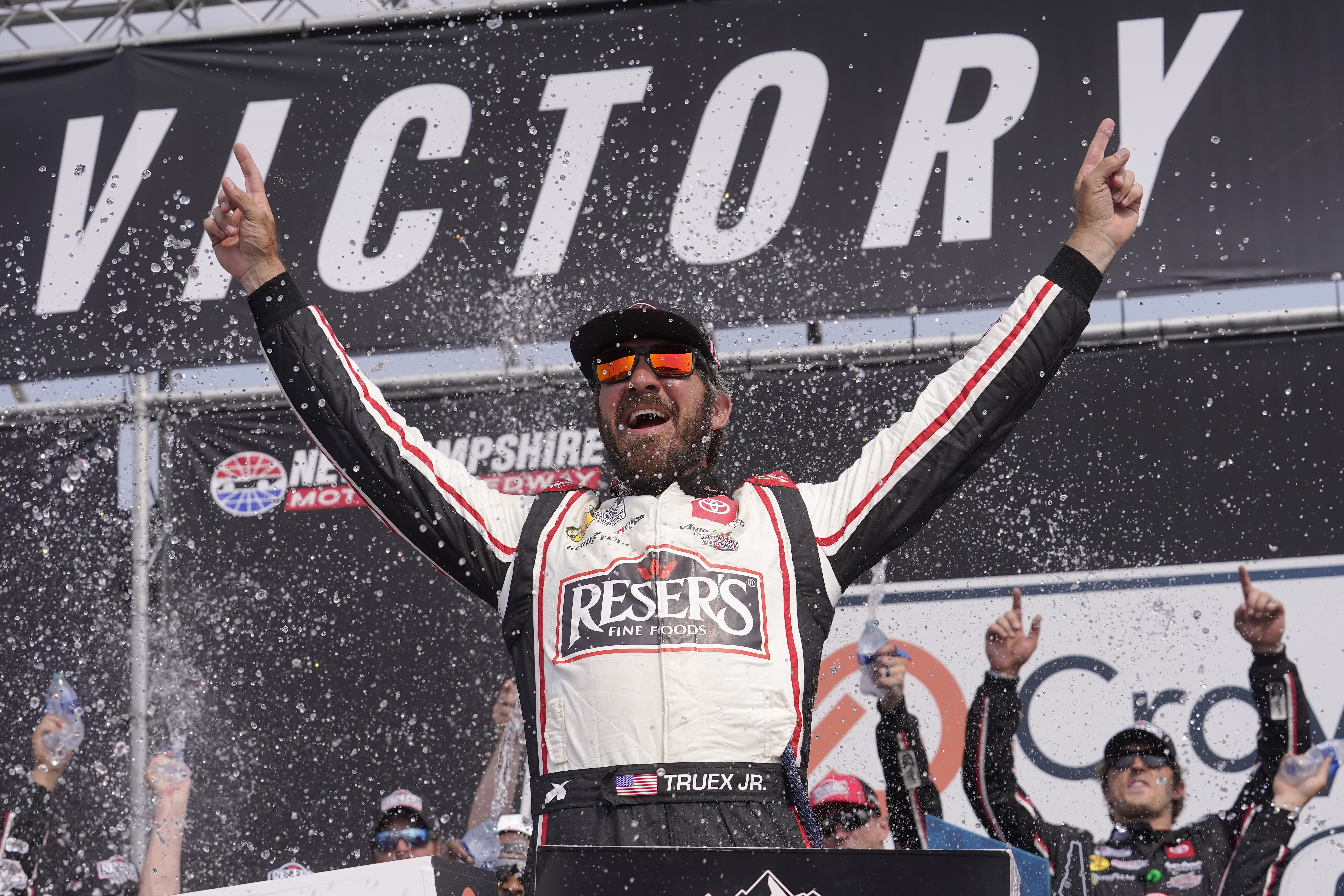 Martin Truex Jr., celebrates his win in the Crayon 301 NASCAR Cup Series auto race, Monday, July 17, 2023, at New Hampshire Motor Speedway, in Loudon, N.H. 