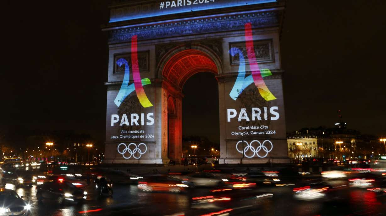 The Eiffel Tower-shaped bid logo for the Paris 2024 is unveiled on The Arc de Triomphe on the Champs Elysees in Paris, France, on Feb. 9, 2016.