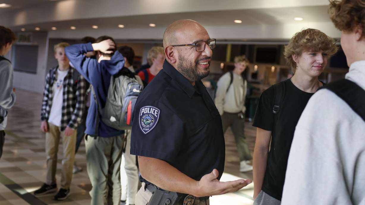 Unified police detective Jaime Cardenas speaks with students at Olympus High School Thursday, Feb. 2. Cardenas has been a school resource officer at the Holladay school for four years.