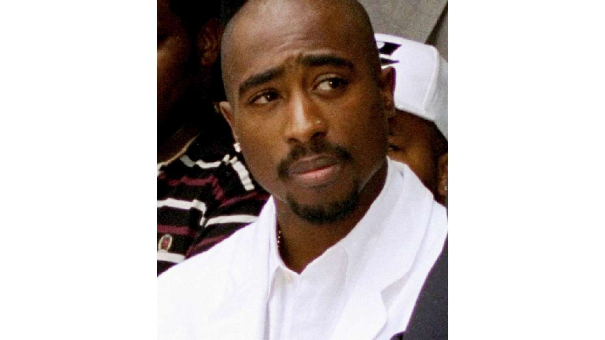 Rapper Tupac Shakur attends a voter registration event in South Central Los Angeles, Aug. 15, 1996. Authorities in Nevada confirmed Tuesday that they served a search warrant this week in connection with the long-unsolved killing of the late rapper.