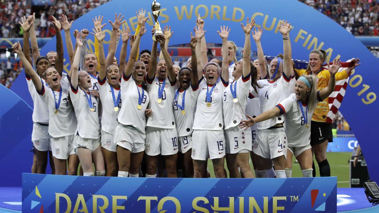 FILE - The United States' team celebrate with the trophy after winning the Women's World Cup final soccer match between against Netherlands at the Stade de Lyon in Decines, outside Lyon, France.