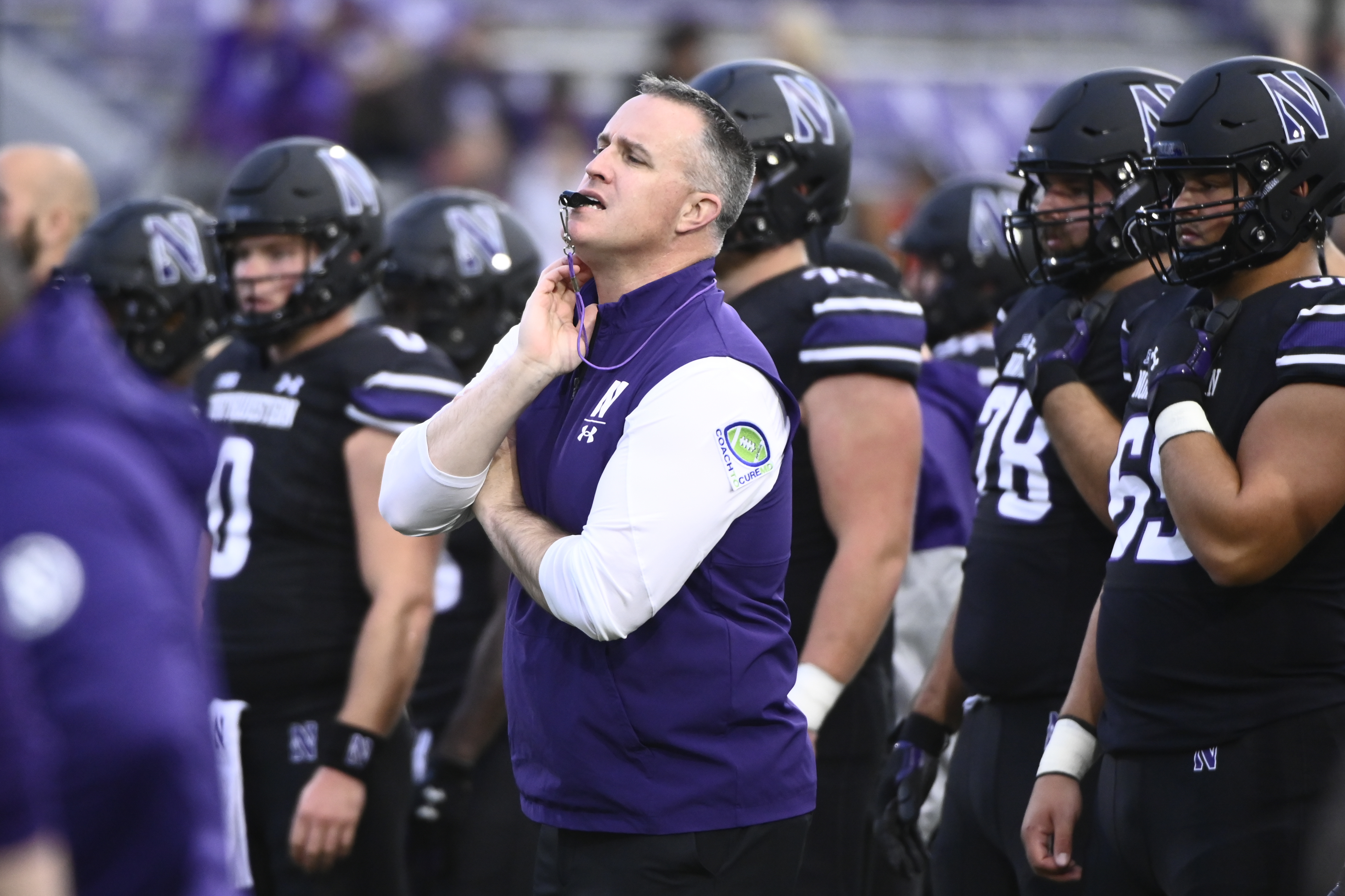 FILE - Northwestern head football coach Pat Fitzgerald directs the team before an NCAA college football game against Miami (Ohio) Saturday, Sept. 24, 2022, in Evanston, Ill. The legal headaches could only be starting for Pat Fitzgerald and Bob Huggins as their attorneys plot the next steps after Northwestern and West Virginia parted ways with them in moves that left some industry experts perplexed. 