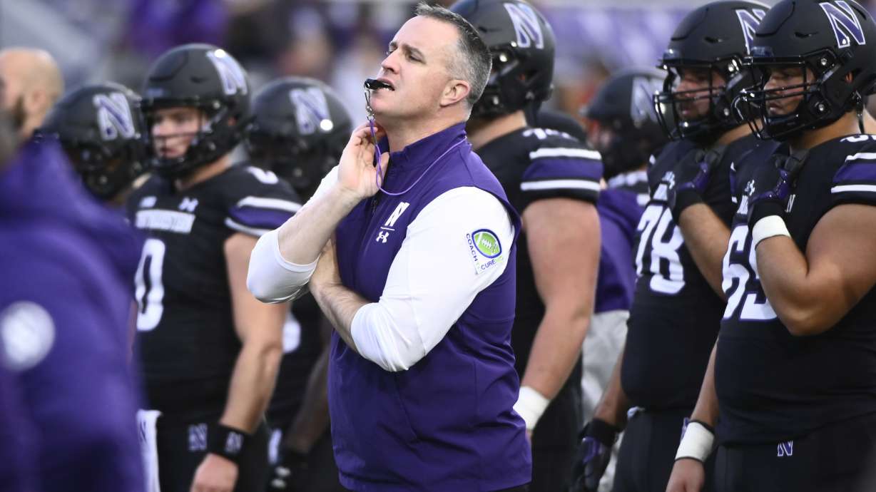 FILE - Northwestern head football coach Pat Fitzgerald directs the team before an NCAA college football game against Miami (Ohio) Saturday, Sept. 24, 2022, in Evanston, Ill. The legal headaches could only be starting for Pat Fitzgerald and Bob Huggins as their attorneys plot the next steps after Northwestern and West Virginia parted ways with them in moves that left some industry experts perplexed.