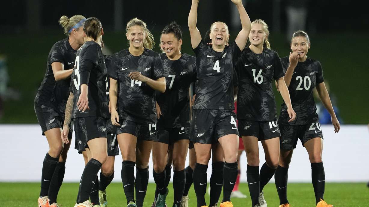 New Zealand's CJ Bott, third right, reacts after scoring her team's first goal during the New Zealand and Vietnam warm up match ahead of the women's World Cup in Napier, New Zealand, Monday, July 10, 2023.