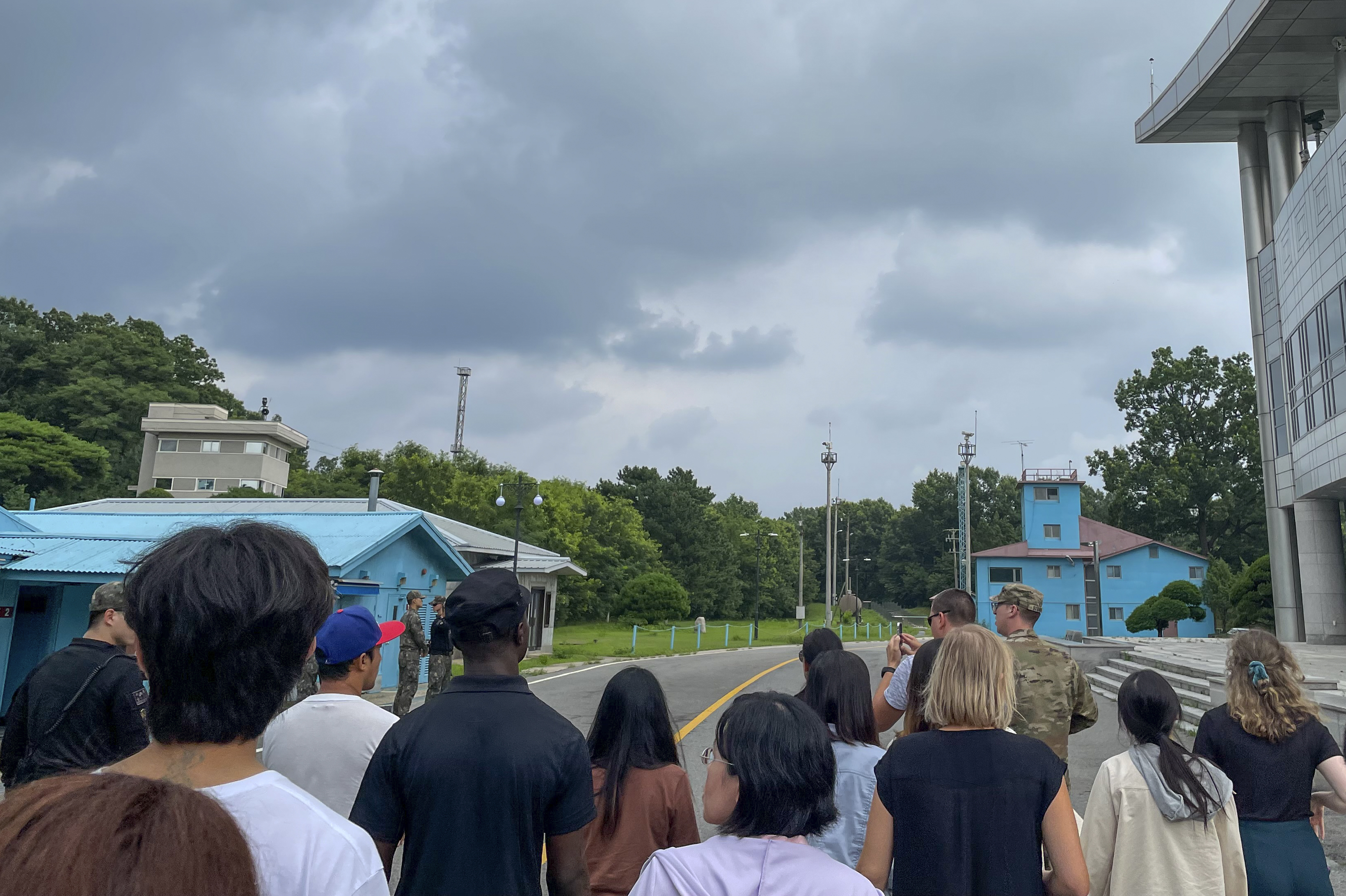 Tourists stand near a border station in the Demilitarized Zone in Paju, South Korea, Tuesday. Travis King, a U.S. soldier, bolted across the border as the first known American detained in the North in nearly five years. 