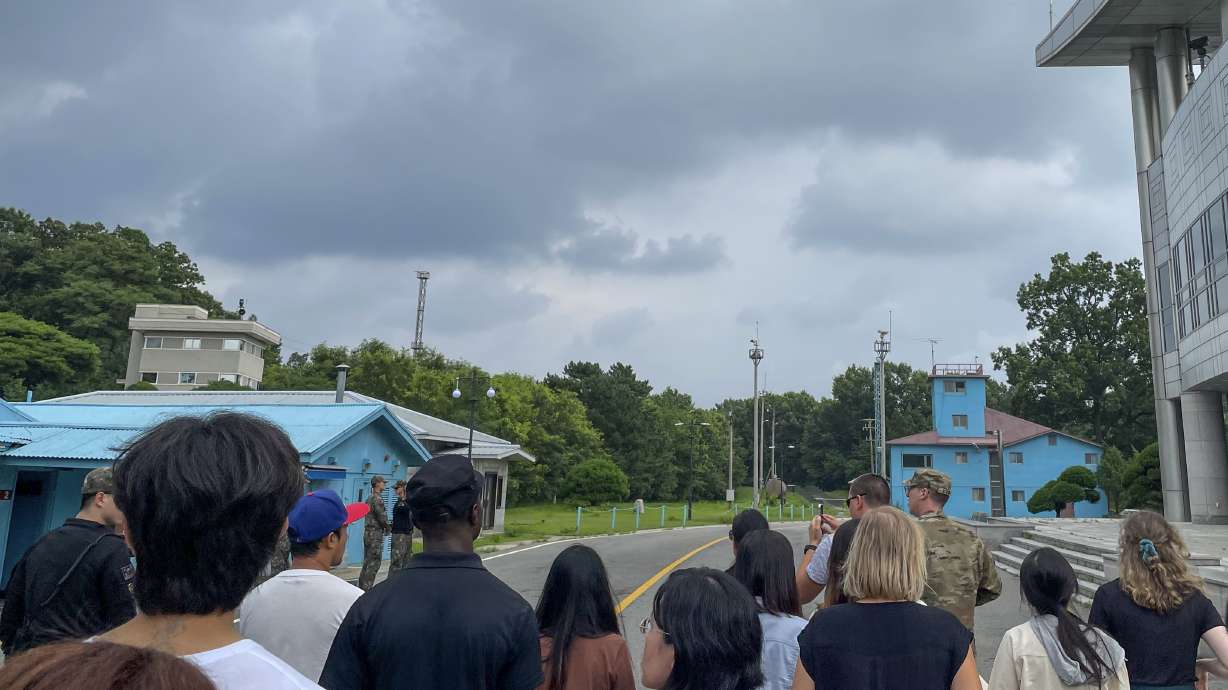 Tourists stand near a border station in the Demilitarized Zone in Paju, South Korea, Tuesday. Travis King, a U.S. soldier, bolted across the border as the first known American detained in the North in nearly five years.