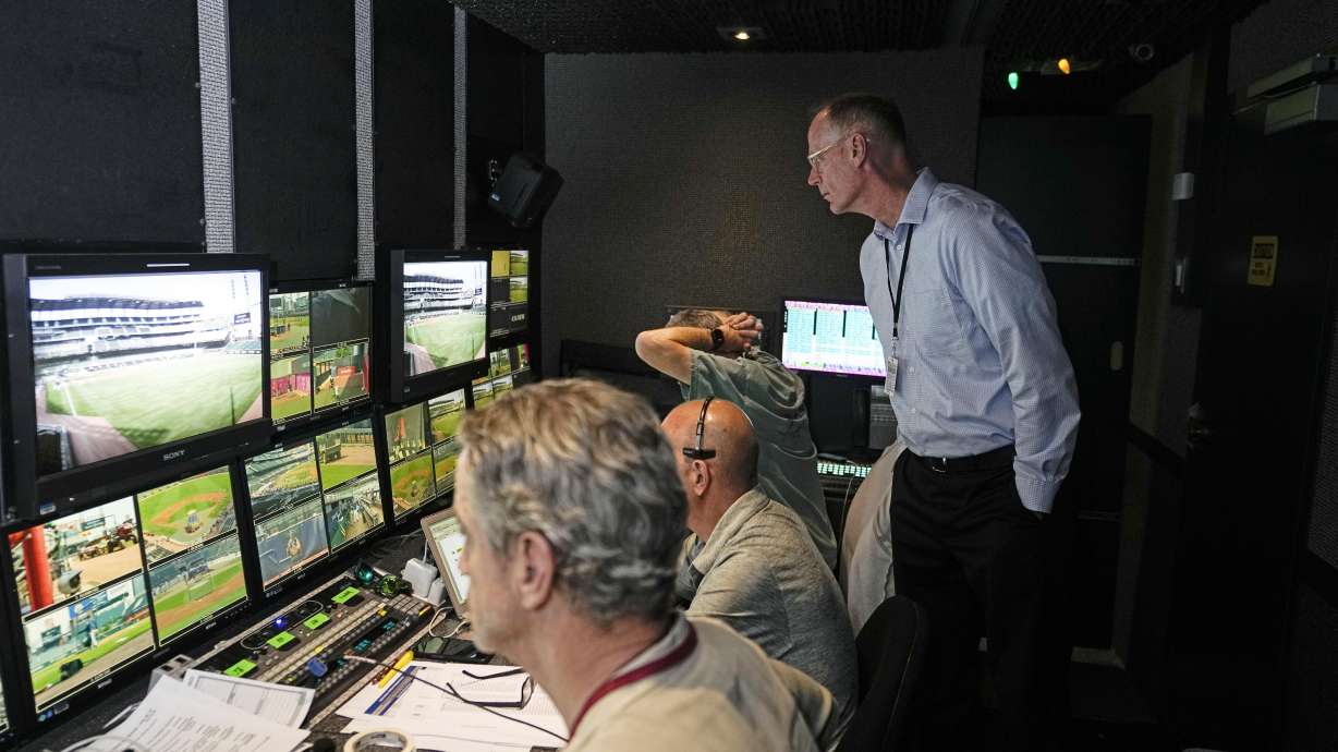 Doug Johnson senior vice president and executive producer for Major League Baseball, watches as producers and directers prepare to broadcast a baseball game between Arizona Diamondbacks and Atlanta Braves Tuesday, July 18, 2023, in Atlanta.