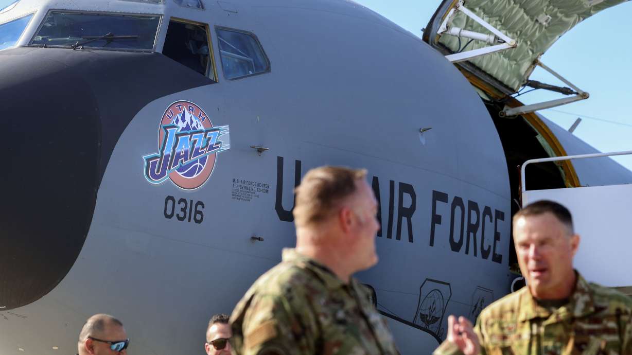 Utah Air National Guardsmen attend the unveiling ceremony of Utah Jazz nose art on a KC-135 refueling tanker at the Utah Air National Guard in Salt Lake City on Wednesday.