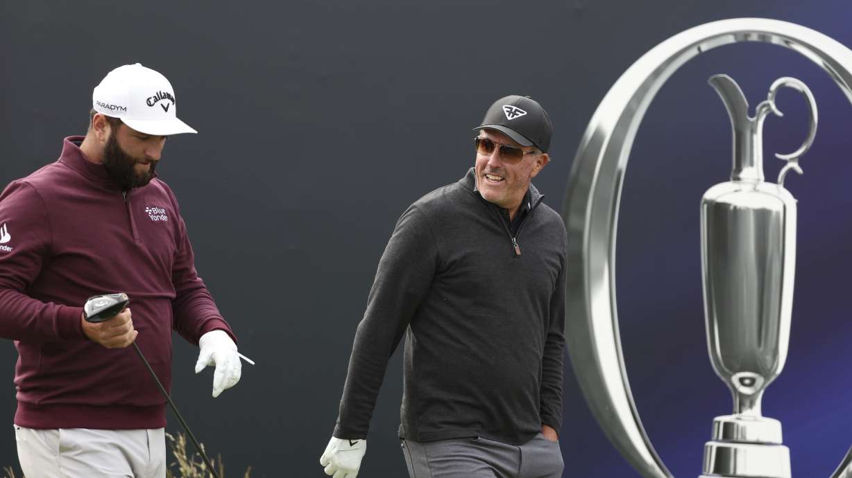 United States' Phil Mickelson, right and Spain's Jon Rahm walk from the 1st tee after playing during a practice round for the British Open Golf Championships at the Royal Liverpool Golf Club in Hoylake, England, Wednesday, July 19, 2023. The Open starts Thursday, July 20.