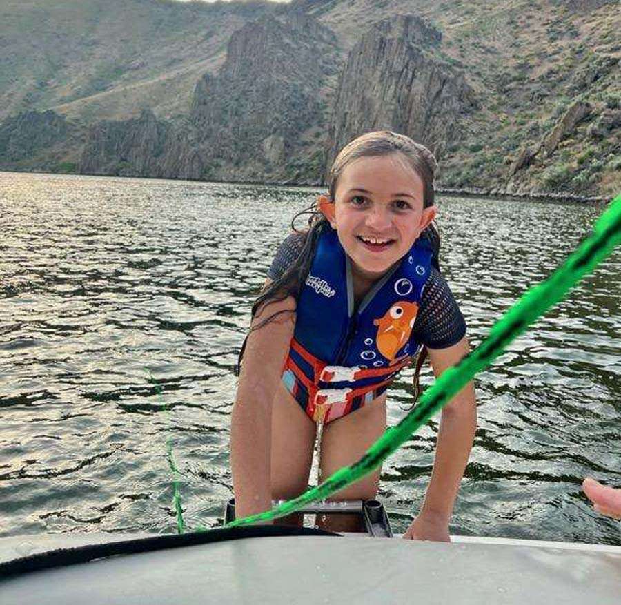 Tasia Noyes is having fun on July 9 at the reservoir. She is recovering at home after she was bitten by a rattlesnake while swimming.