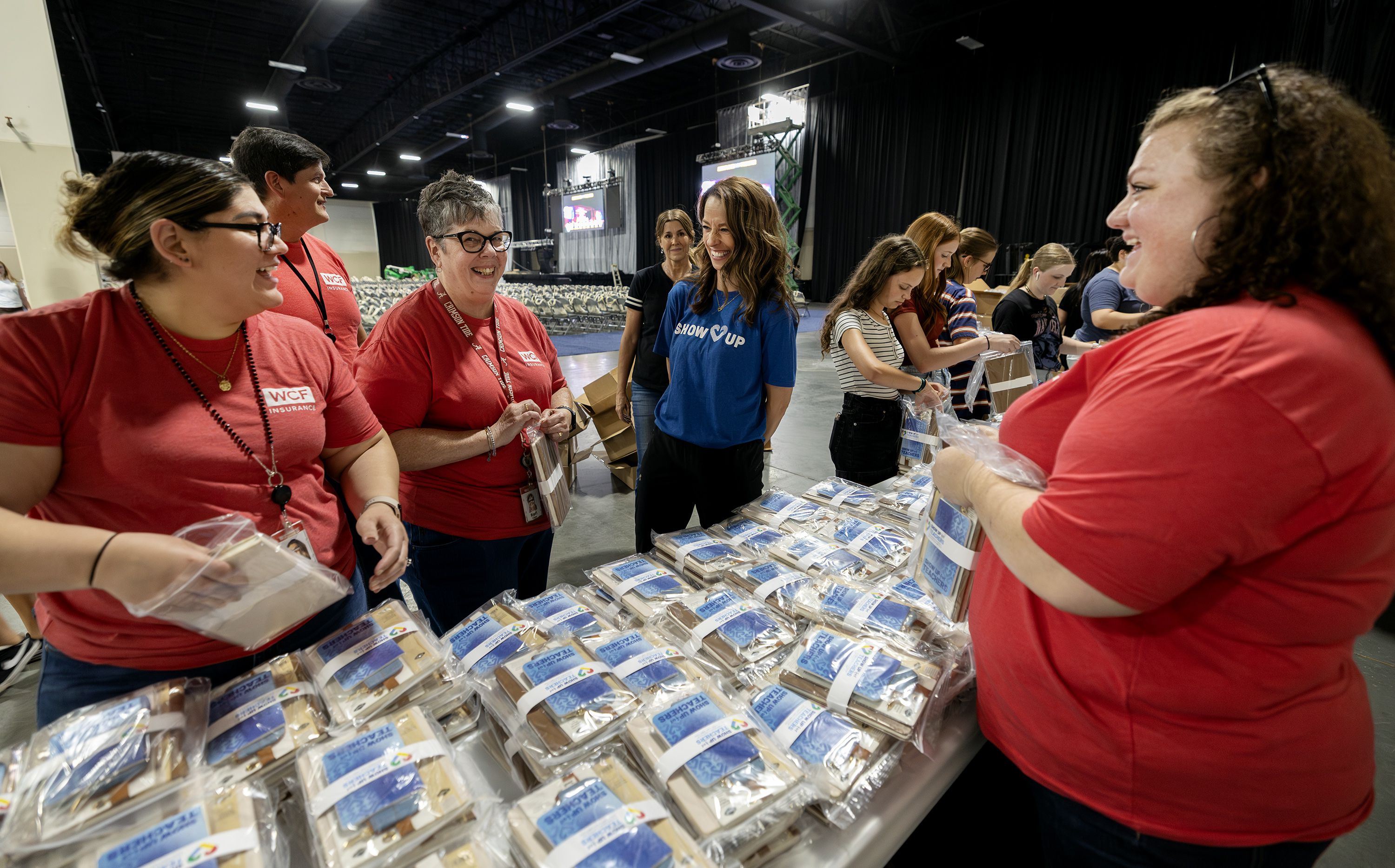 Utah first lady Abby Cox talks with a group of volunteers as they work with her team to get ready for the Show Up for Teachers event at the Mountain America Exhibition Center in Sandy on Tuesday.