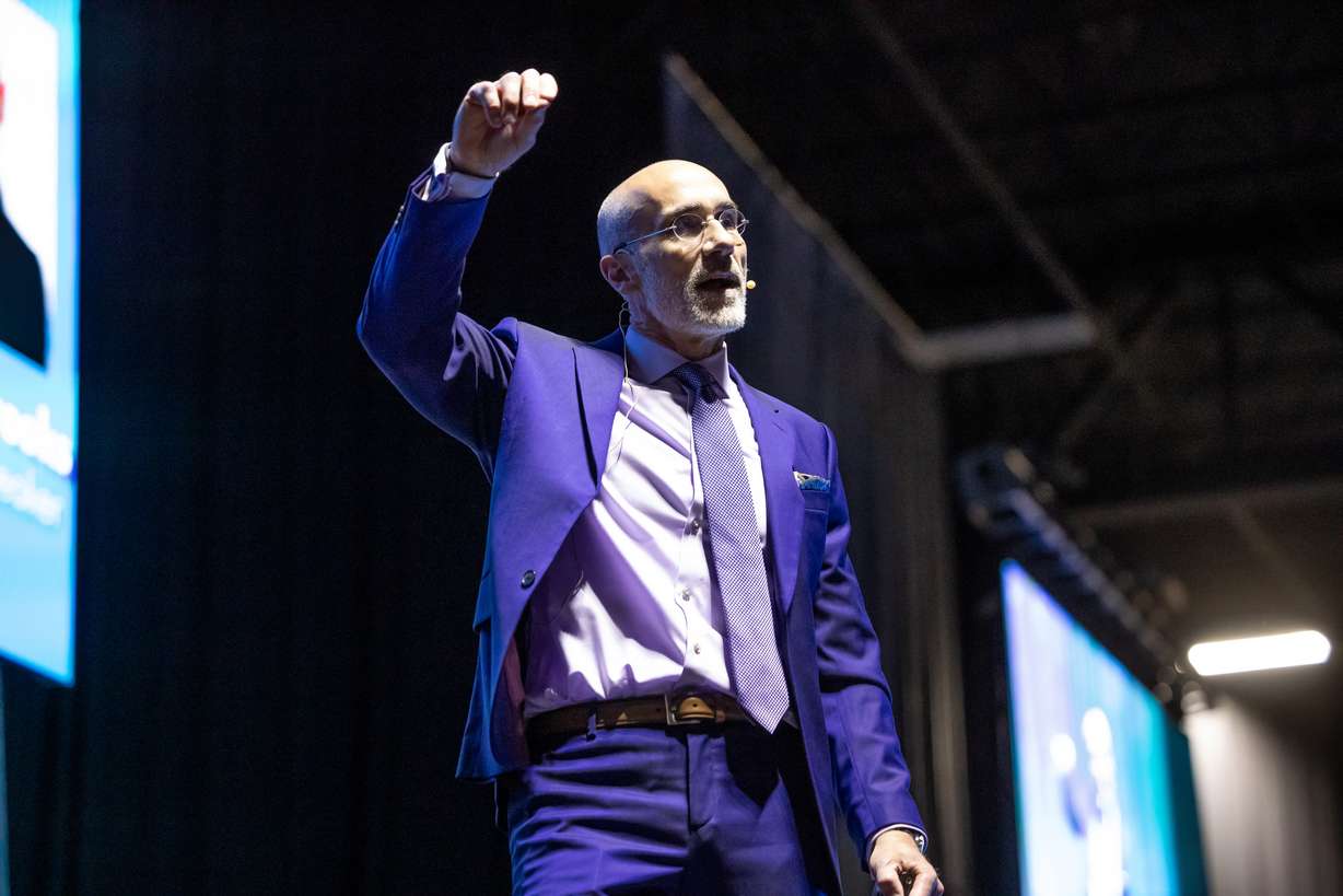 Author and Harvard Business School professor Arthur C. Brooks speaks at the Show Up for Teachers Conference at the Mountain America Expo Center in Sandy on Wednesday.