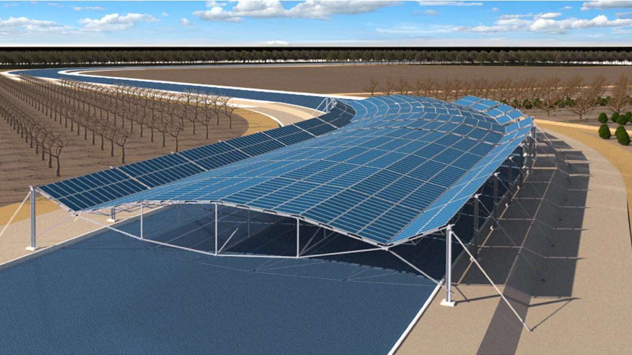 This artist’s rendering provided by Solar AquaGrid, shows a wide-span solar canal canopy being piloted in California’s Central Valley. Solar panels are installed over canals in sunny, water-scarce regions where they make electricity and reduce evaporation.