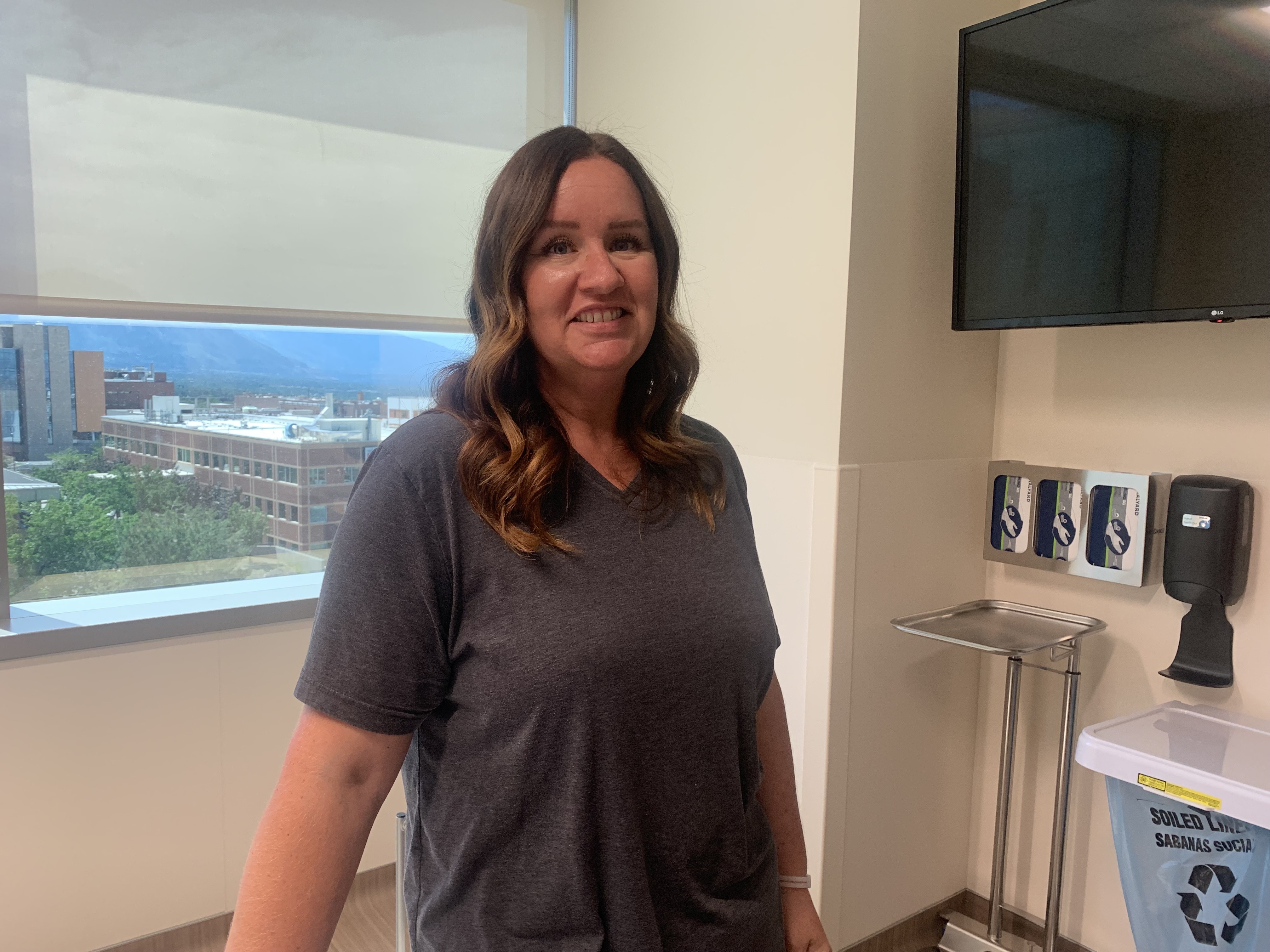Jade Barton, a patient, stands in a pre-op room at the Huntsman Cancer Institute on Wednesday. The operating rooms in the Kathryn F. Kirk Center, an expansion of the Huntsman Cancer Institute, are preparing to open.
