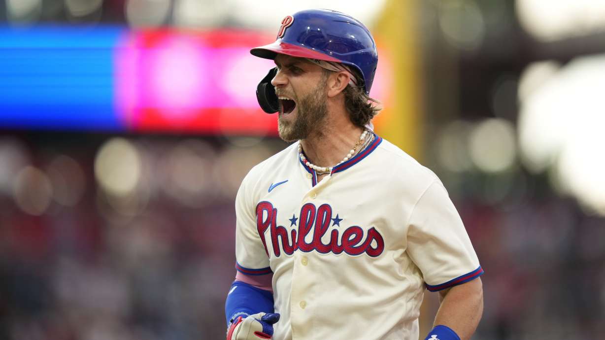 Philadelphia Phillies' Bryce Harper reacts after hitting a run-scoring single during the 10th inning of a baseball game against the San Diego Padres, Sunday, July 16, 2023, in Philadelphia.