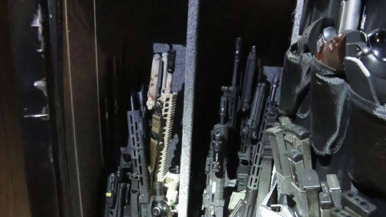 Employees at a Taylorsville sporting goods store have been arrested and criminally charged for allegedly stealing more than two dozen weapons.