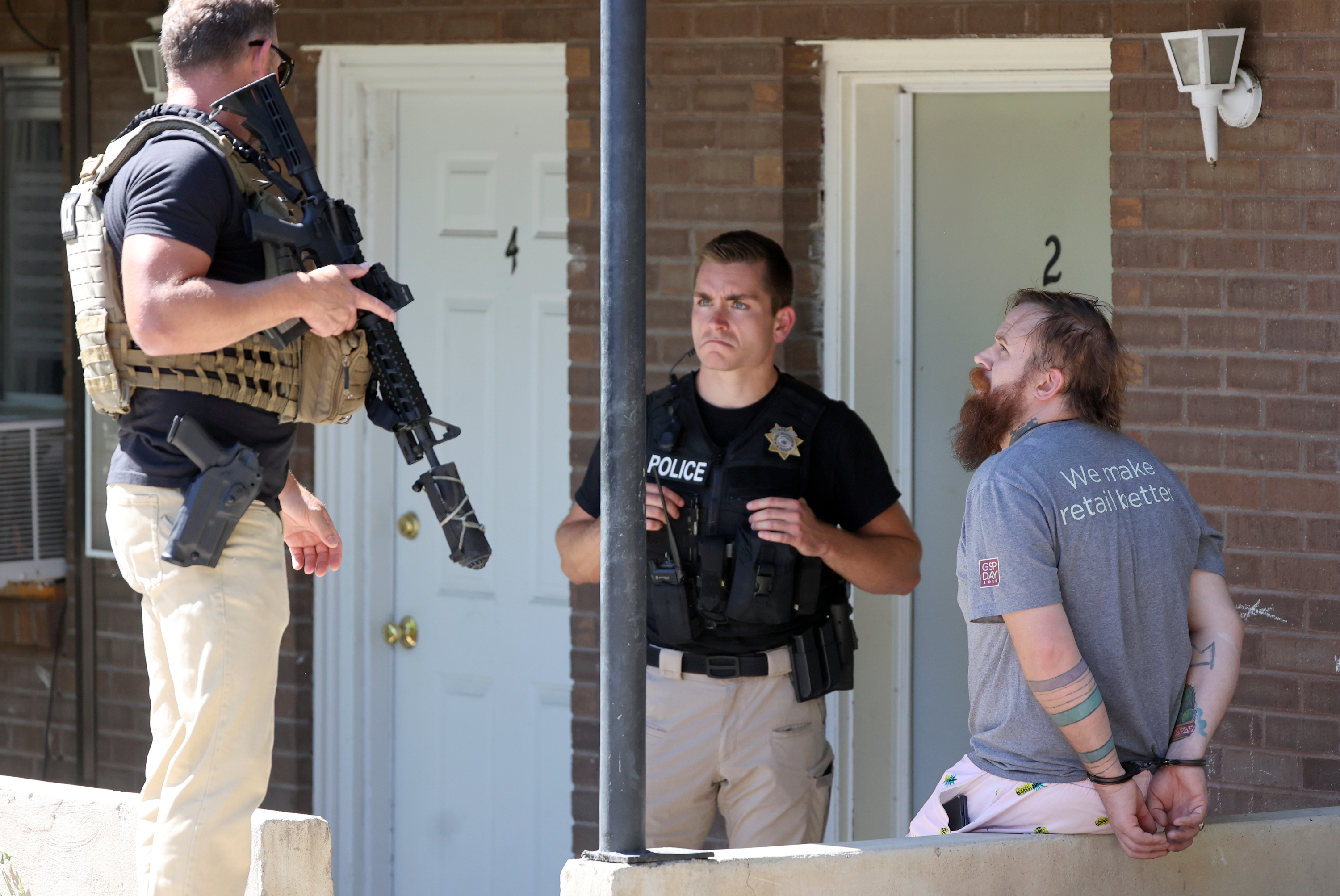 Adult Probation and Parole agents take a probation fugitive into custody in South Salt Lake on Thursday. Agents said the man was on probation for third-degree felony aggravated assault with domestic violence enhancement.