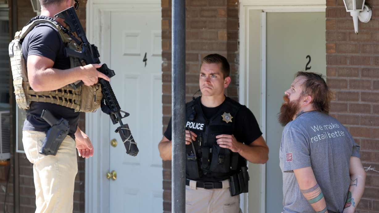 Adult Probation and Parole agents take a probation fugitive into custody in South Salt Lake on Thursday. Agents said the man was on probation for third-degree felony aggravated assault with domestic violence enhancement.