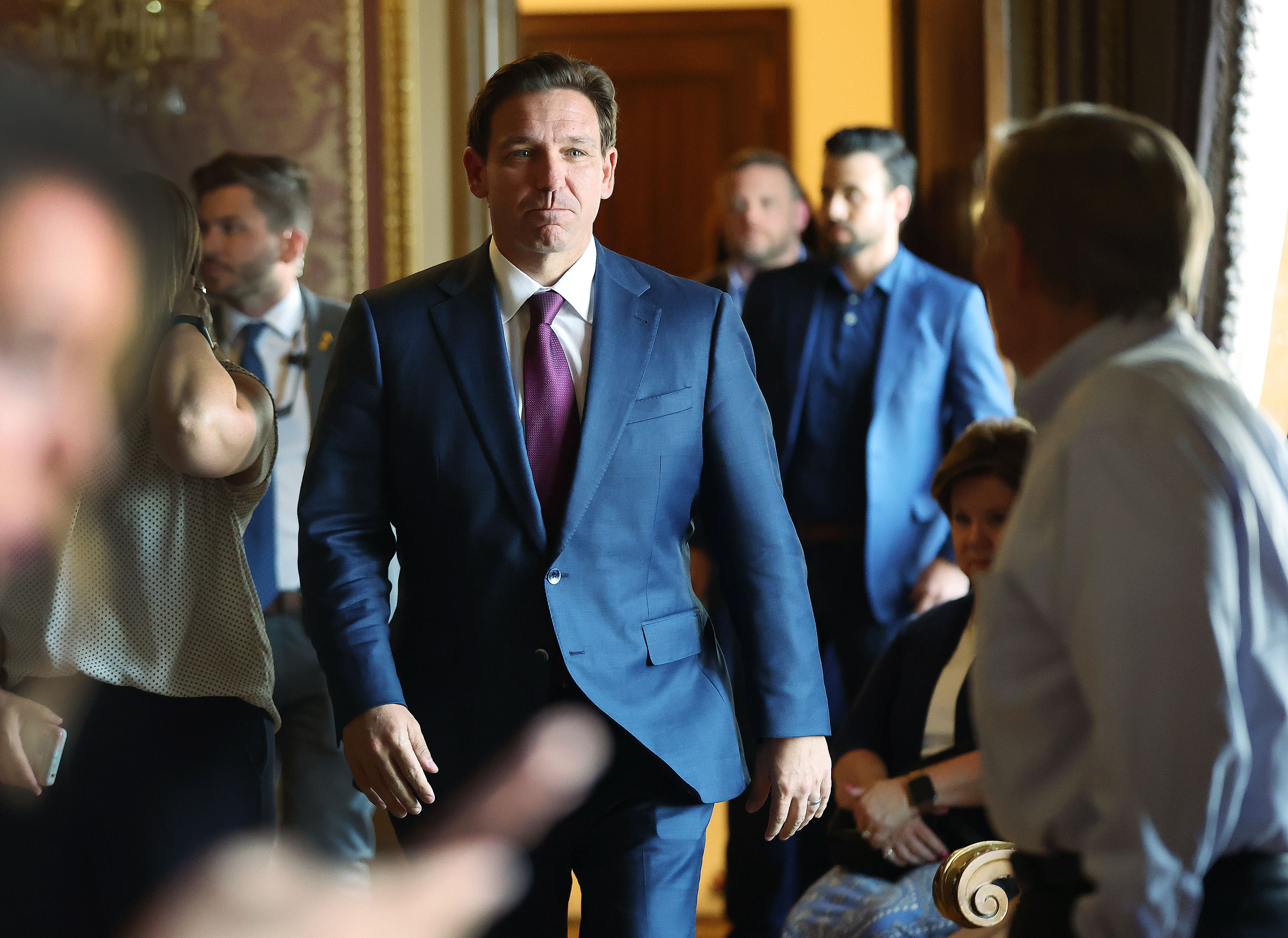 Florida governor and presidential candidate Ron DeSantis walks into a press conference at the Capitol in Salt Lake City on Friday.