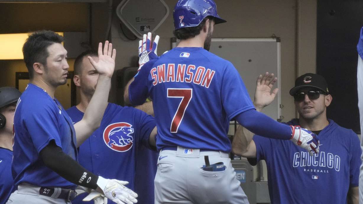 Chicago Cubs' Dansby Swanson is congratulated after hitting a home run during the third inning of a baseball game against the Milwaukee Brewers Tuesday, July 4, 2023, in Milwaukee.