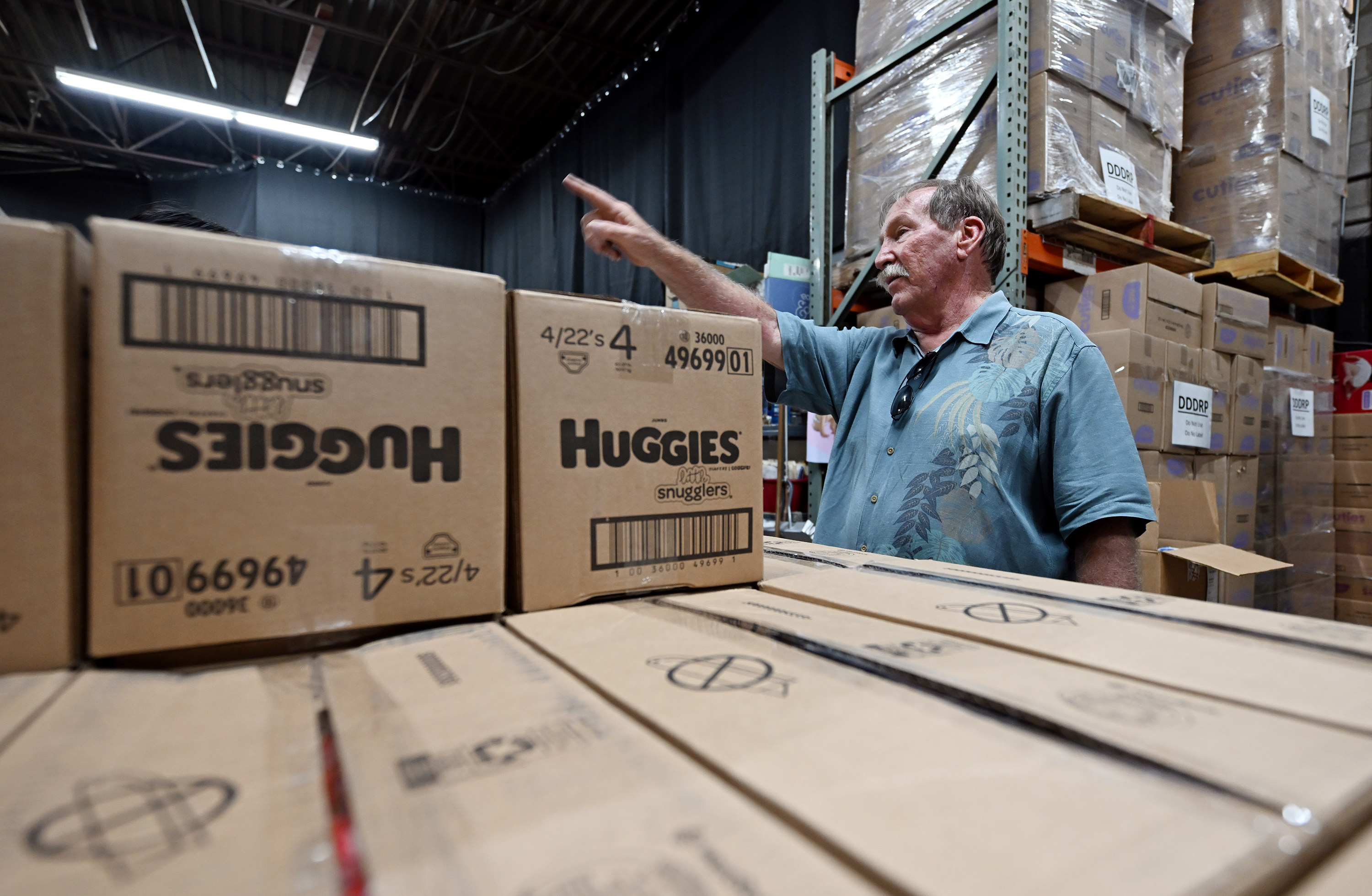 Vic Velivis, founder and executive director of the Utah Diaper Bank, working at the Utah Diaper Bank in Murray, July 21, 2023. The Utah Food Bank announced Friday that it will acquire the Utah Diaper Bank and create a new UFB Diaper Program.