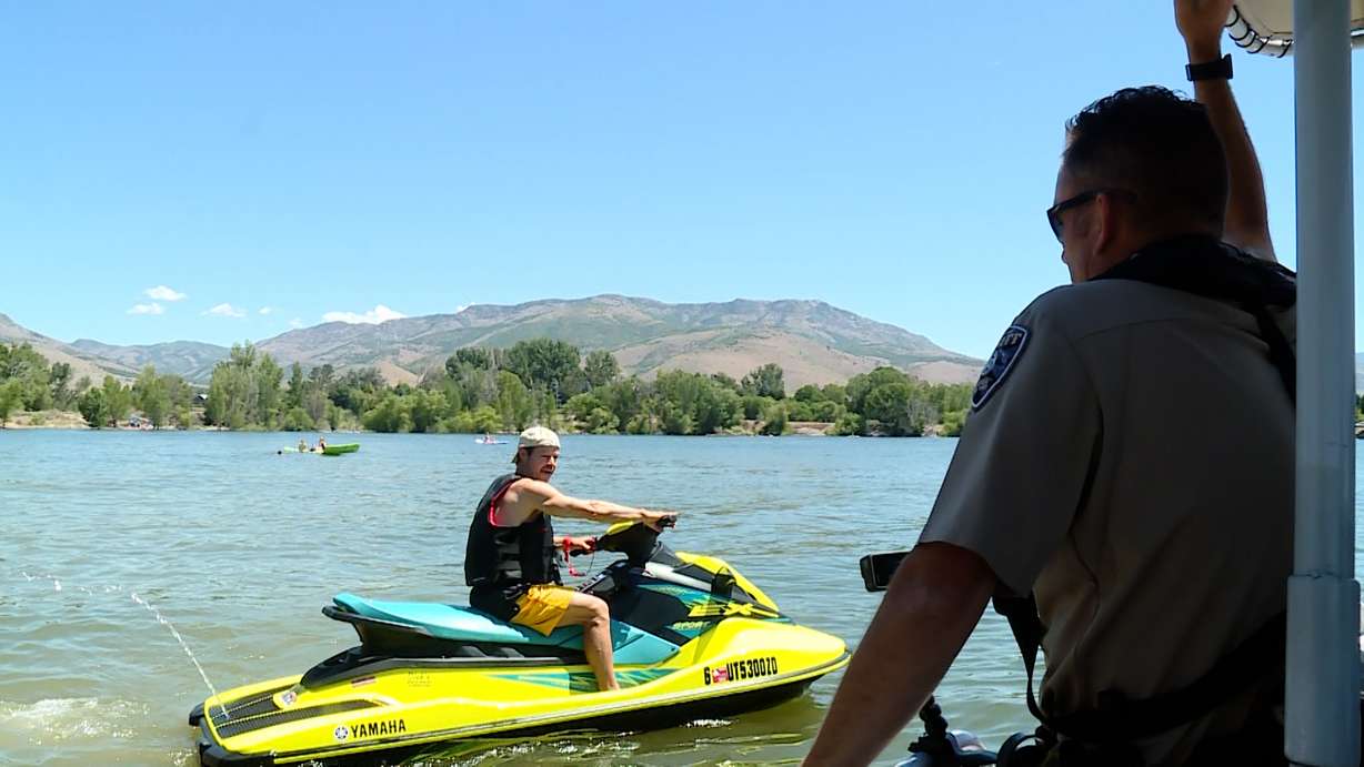 Deputy Campbell warns a driver about being in a no-boat area. As more and more people try to cool off at Utah's lakes and reservoirs, more police patrol the area to keep everyone safe.
