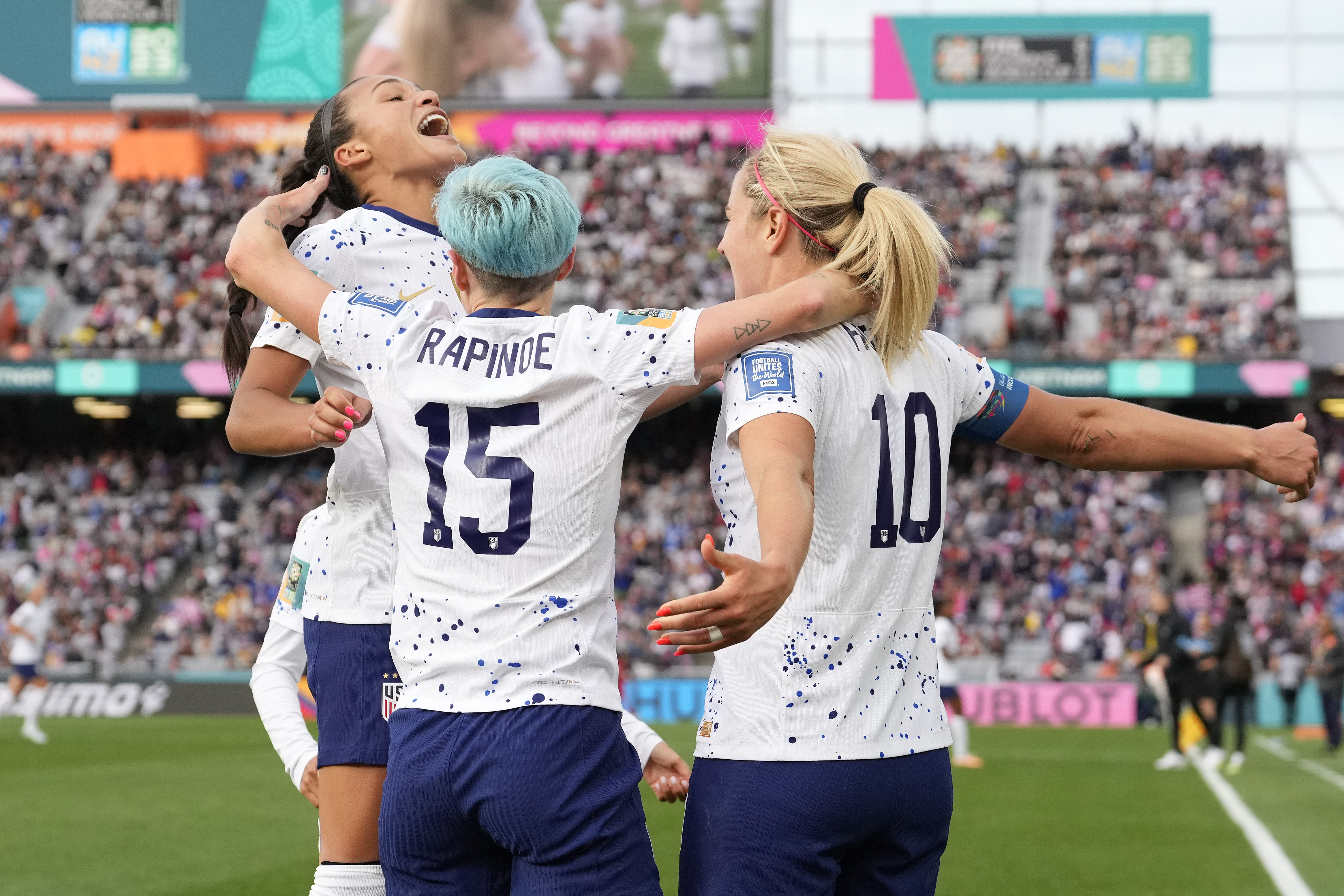 United States' Lindsey Horan, right, celebrates with Sophia Smith, left, and Megan Rapinoe after scoring during the Women's World Cup soccer match between the United States and Vietnam at Eden Park in Auckland, New Zealand, Saturday, July 22, 2023.