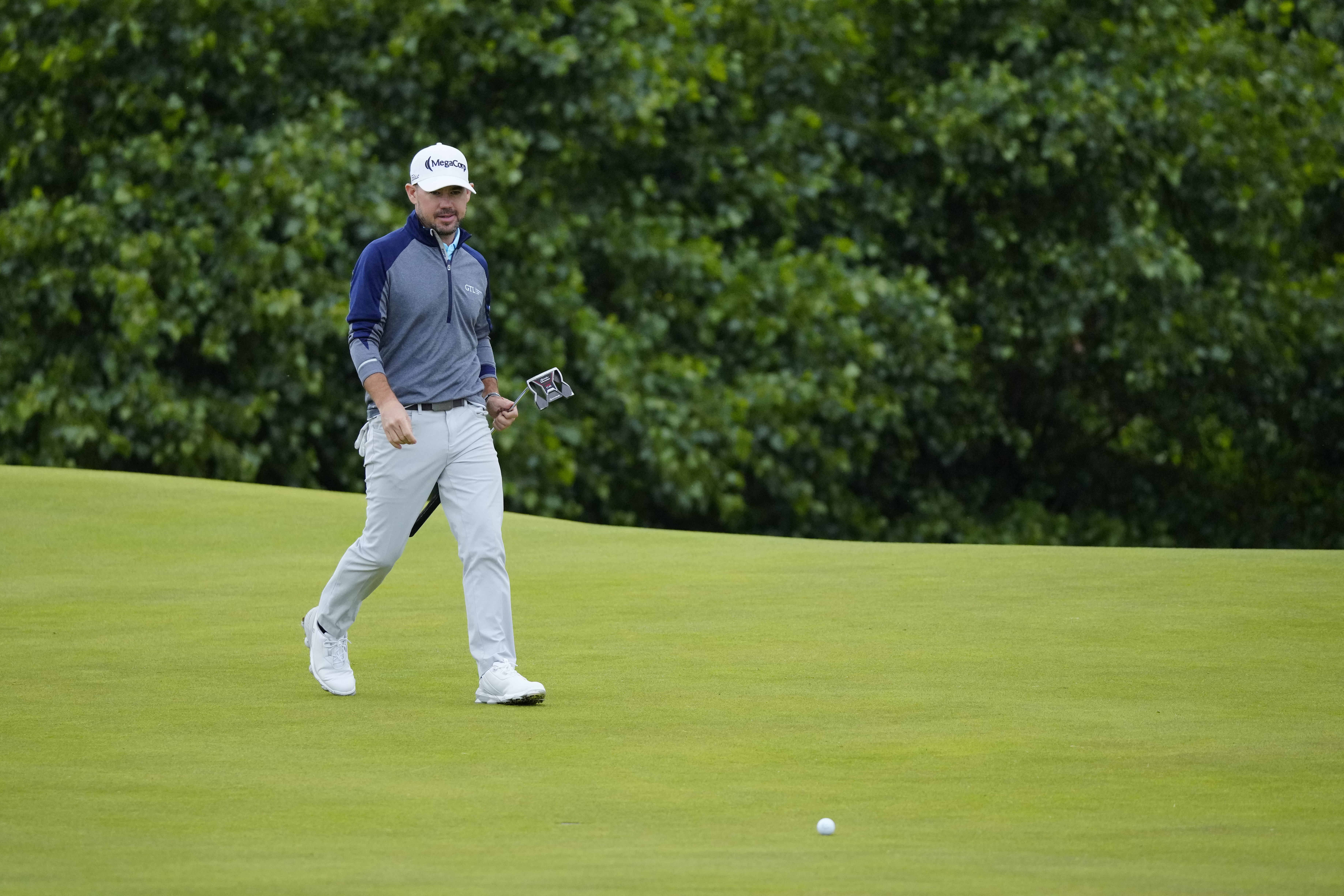 United States' Brian Harman looks at his putt on the 17th green during the third day of the British Open Golf Championships at the Royal Liverpool Golf Club in Hoylake, England, Saturday, July 22, 2023.