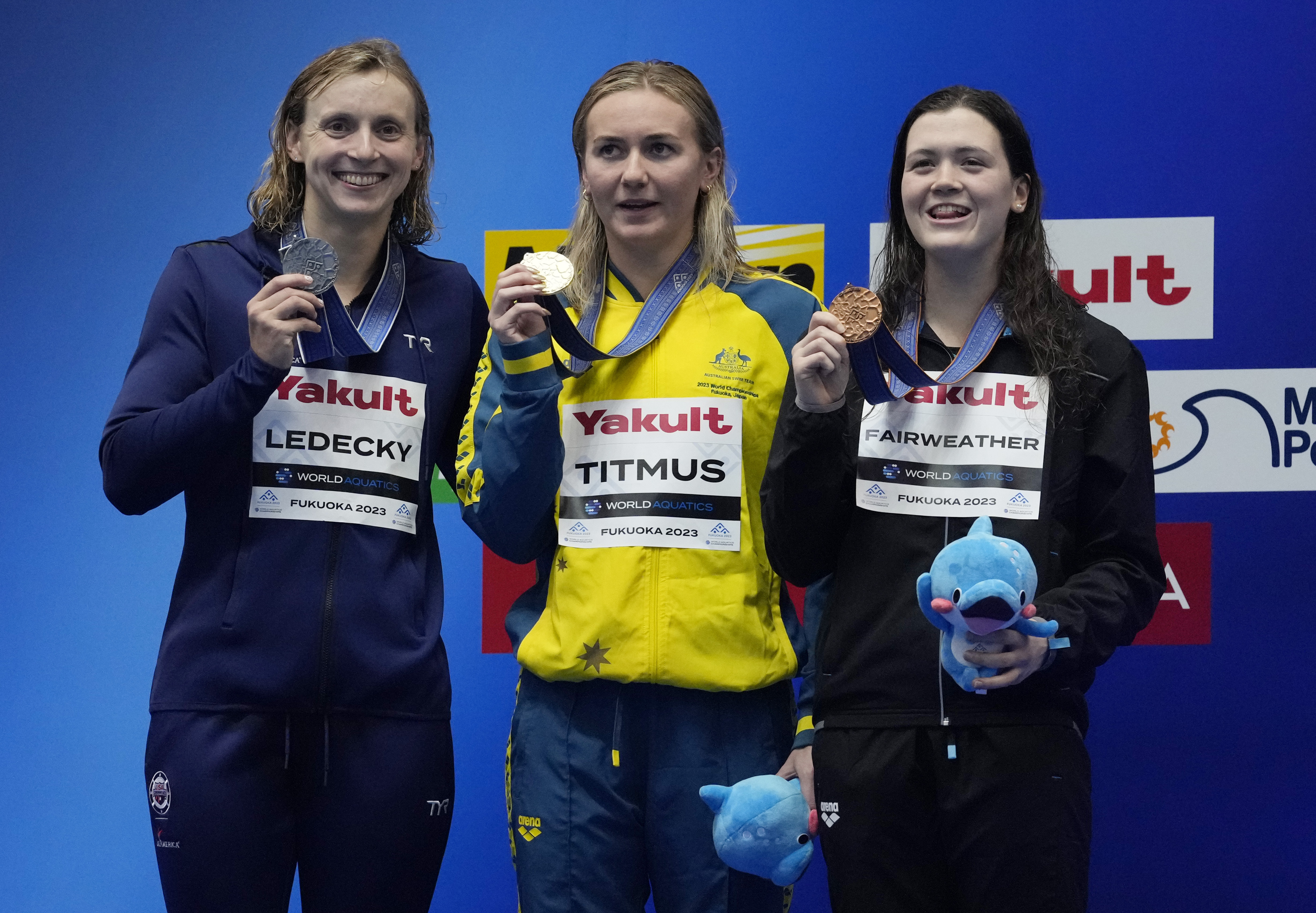 Gold medallist Ariarne Titmus of Australia, center, is flanked by silver medallist Katie Ledecky of the United States, and bronze medallist Erika Fairweather of New Zealand as they pose with their medals after winning Women 400m Freestyle finals at the World Swimming Championships in Fukuoka, Japan, Sunday, July 23, 2023. 